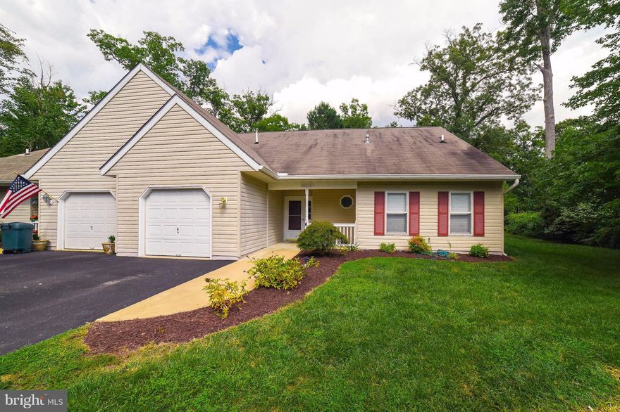 Immaculate home in Wildewood Village, an over 55 community.  2 bdrms on the main level plus an upper level with a large loft (upstairs family room/craft area??) plus another room that could be used as a 3rd bdrm but has no window. 7'x7' office adjoining kit. with built-in desk.  Just painted from top to bottom and all new carpet and kitchen appliances. Screen porch backs to trees. Move in ready!