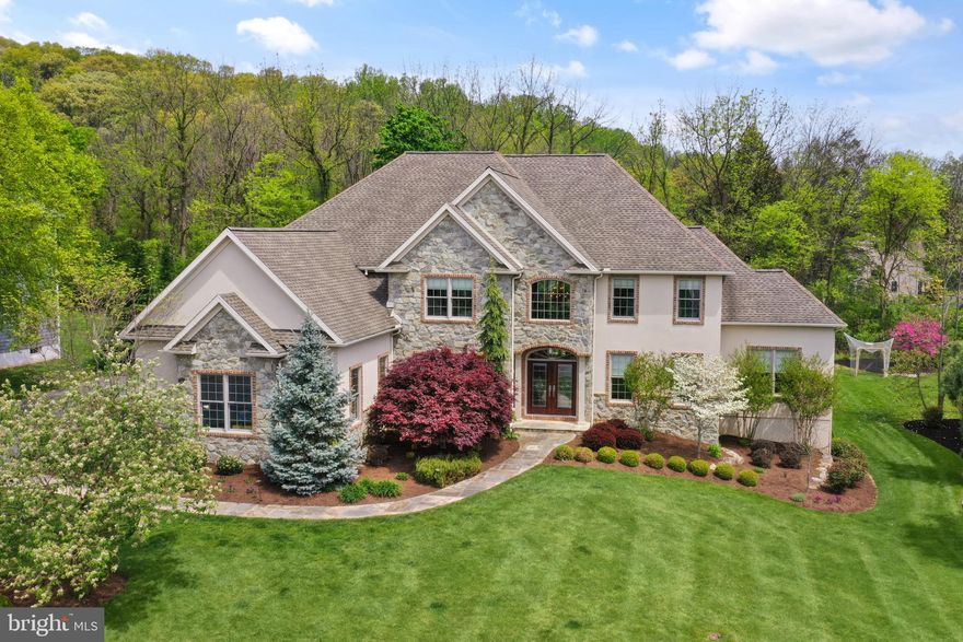 Nestled within the prestigious Green Valley Heights neighborhood, this custom-built masterpiece by Elite Home Builders embodies luxury living at its finest. Boasting exquisite craftsmanship and attention to detail, this 5-bedroom, 5.5-bathroom residence epitomizes elegance and comfort.  The main floor features a stunning great room, spacious dining room, cozy family room and an in-law suite, offering convenience and privacy for guests or multi-generational living.

Entertainment knows no bounds with the expansive finished basement, complete with a wet bar and stone surround as well as a fitness room and ample space for entertaining.  The outdoor living space is equally desireable featuring an outdoor cooking space and sleek gas fire feature.  

Retreat to the owner's suite, where tranquility awaits. This sanctuary features a spacious sitting room with gas fireplace and a luxurious bathroom with radiat floor heating and a walk-in Roman shower  ensuring relaxation and rejuvenation after a long day.  Multiple walk-in closets provide plently of storage as well.  

The heart of the home lies in the chef's kitchen, equipped with top-of-the-line appliances including 2 Miele dishwashers, a 6-burner gas range, a Bosch refrigerator, and a coffee/cappuccino/espresso machine. Whether you're a culinary enthusiast or simply enjoy cooking, this kitchen is sure to impress.

Additional highlights include an office and den on the first floor, providing the perfect space for remote work or quiet reflection. The home is also equipped with modern amenities such as an RO drinking water system and a Bang & Olufsen sound system, enhancing quality of life and entertainment.

Convenience meets luxury with the three car side-entry garage, offering ample parking and storage space. Located in the sought-after Wilson School District, this home offers the perfect blend of suburban tranquility and close proximity to shopping, restaurants and ammenities.