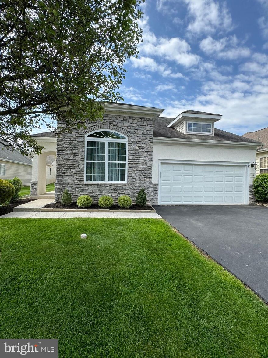 Welcome to easy living in a premier 55+ community at Heritage Creek Estates in Warwick! This impeccably maintained 2-bedroom, 2 ½ bathroom home offers 2,321 square feet of luxury living for active adults.
The first floor features a spacious living room with an elevated ceiling and arched double windows. A dining room with an impressive turned, open staircase leads to the second floor. The open floor plan with new flooring effortlessly blends a large eat-in kitchen with a dining area, a sun-filled sunroom, and a dramatic 2-story cathedral ceiling family room. The kitchen features new kitchen cabinets with soft close drawers, and pull-out shelves, a gas stove, microwave, 2-year-new stainless-steel refrigerator, granite countertops, tile backsplash, and a large island. Enjoy the large family room immersed in natural light and a gas fireplace providing a perfect space for entertaining family and friends or peaceful evenings at home. The first-floor owner's suite provides two closets including a walk-in, a large bay window and a plush primary bathroom with a soaking tub, separate shower stall, double vanity, and a linen closet. Also on the first floor is a laundry room with washer and dryer, laundry tub, and cabinets, that lead to a 2-car garage. The upper floor features a second bedroom and a full bathroom. A second-floor walkway offers a spectacular view of the 2-story family room and leads to a multipurpose loft, perfect for an additional study or office. The loft provides an impressive view of the lower foyer and living room. For your safety this home offers a security system. The community clubhouse offers a fitness center, bocce court, tennis courts, outdoor and indoor swimming pools, a library, billiards room, and social activities provide endless opportunities for recreation or leisure activities. A scenic walking trail is located in the nearby adjacent Memorial Park. The Heritage Creek community will not disappoint with sidewalks and tree-lined streets, this resort like community offers maintenance-free living with lawn maintenance, snow removal, and trash removal.  Coupled with a convenient location near shopping centers, major commuting routes, train station, and restaurants, this home offers the luxury and neighborhood you have been looking for. SHOWINGS BEGIN ON Thursday May 9th. Schedule an appointment soon to see all this vibrant community has to offer!