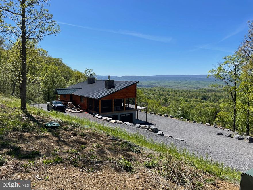 MODERN MOUNTAIN MASTERPIECE.....CUSTOM CONTEMPORARY LOG HOME ON 20 PRIVATE ACRES ELEVATED AT 1400 FT ATOP "MIDDLE RIDGE" OFFERING PANORAMIC PLEASURES BEYOND BELIEF....VIEWS OF 3 STATES, THE PATTERSON CREEK VALLEY AND BEYOND.....NORTHWEST ORIENTATION FOR SINFULLY SERENE SUNSETS.......TOTAL SENSORY OVERLOAD! BUILT IN 2019 BY THE AREAS PREMIER BUILDER "BRYSON HOMES" THIS HOME ILICITS A VISCERAL REACTION THE MOMENT YOU WALK THROUGH THE DOOR, LIKE A STIFF SLAP IN THE FACE, IT GETS YOUR ATTENTION! BEYOND WELL APPOINTED..... EVERY BELL & WHISTLE: GOURMET LEVEL KITCHEN WITH GE PROFILE SS APPLIANCES & SOAPSTONE COUNTERS, LUTRON CASETA CONTROLLED LED LIGHTING THROUGHOUT, WHOLE HOUSE SPRINKLER SYSTEM, WHOLE HOUSE GENERATOR, ZONED HEATING FOR EACH ROOM, TOTO WASHLESS TOILETS, SONOS AUDIO SYSTEM, SIMPLISAFE SECURITY SYSTEM, MASSIVE SCREENED PORCH WITH FIREPLACE, 20X30 POLE BARN......THE LIST GOES ON.....WORK REMOTELY WITHOUT EFFORT OR WORRY WITH ENTERPRISE GRADE NETWORK POWERED BY STARLINK & T MOBILE 5G.....CONDUCT BUSINESS ANYWHERE IN THE WORLD FROM YOUR MOUNTAIN PARADISE....PRACTICALLY SPEAKING, THE WHOLE HOUSE CAN BE CONTROLLED BY PHONE. CONVEYS TURNKEY, FULLY FURNISHED AND READY TO ENJOY! LOCATED IN THE PRESTIGIOUS GATED COMMUNITY OF "THE BLUFFS ON THE POTOMAC".....THE BLUFFS IS KNOWN FOR IT'S ABUNDANCE OF BIG BUCKS, BEAR & TURKEY. AS AN ADDED BONUS, THE COMMUNITY HAS IT'S OWN PRIVATE COMMON AREA ON THE SOUTH BRANCH OF THE POTOMAC RIVER FOR CANOE, KAYAK, TUBES, FISH & SWIM......A PRIVATE PARK ON THE RIVER FOR YOUR SUMMERTIME ENJOYMENT. FAIR WARNING....YOU'RE GONNA HAVE A LOT OF NEW FRIENDS IF YOU BUY THIS PLACE ...... EVERYONE IS GONNA WANT TO COME FOR A VISIT....TREAT YOURSELF TO SOMETHING SPECIAL, SOMETHING YOU CAN BE PROUD OF....A PLACE THAT YOU CAN'T WAIT TO GET TO AND HATE TO LEAVE! YOU COULDN'T START FROM SCRATCH AND REPLICATE FOR THE LIST PRICE, NOT TO MENTION THE TIME & STRESS INVOLVED WITH A PROJECT OF THIS MAGNITUDE.....HIT THE EASY BUTTON AND ENJOY THE FRUITS OF SOMEONE ELSES LABOR!