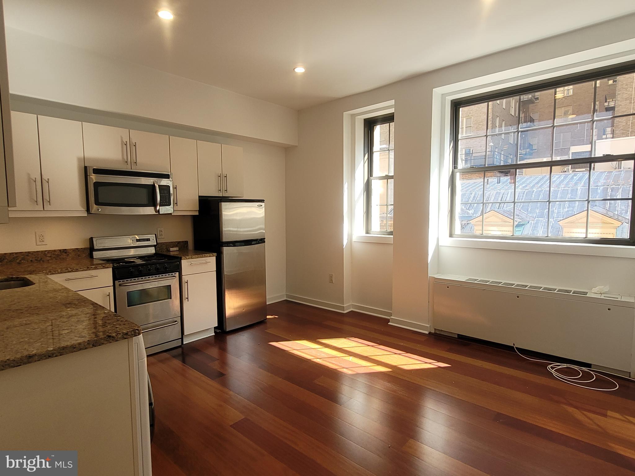 Beautiful junior one bedroom with southern views at Parc Rittenhouse right on Rittenhouse Square! Enter this sunny home through a foyer with coat closet into the spacious great room with excellent natural light, space for living and dining, and an open kitchen. The beautifully appointed kitchen features granite countertops, custom cabinetry, and stainless steel appliances. The bedroom enjoys a wall closet and use of a marble-appointed hall bathroom with large vanity and tub shower. Additional highlights include a washer/dryer, recessed lighting, and Brazilian cherry hardwood floors throughout. Residents of Parc Rittenhouse enjoy world class amenities and services including a 24 hour doorman; an amenities suite that includes a brand new state-of-the-art fitness center and resident lounge with pantry; media room; outdoor rooftop pool club with a large pool deck, full size pool, kids pool and hot tub; garage parking below the building for an additional fee; and two amazing restaurants on the ground floor, Stephen Starr’s Parc and Via Locusta.