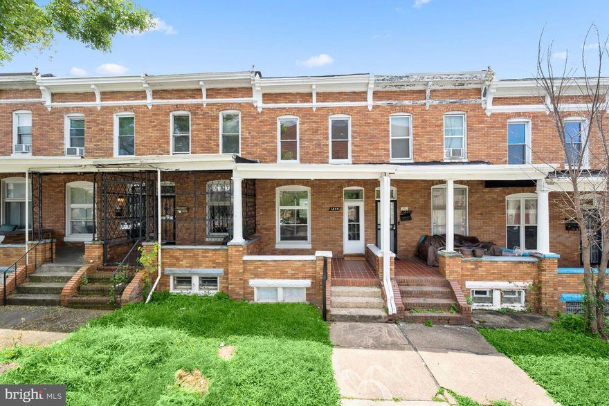 Professional photos coming soon! Move-in ready - freshly painted & new carpet! Spacious brick rowhome featuring an inviting covered front porch and spacious foyer hosting original hardwood floors.  The sizable living and dining rooms are both perfect for entertaining.  The galley kitchen has gas cooking, solid wood cabinets, white appliances and space for bistro set or additional storage.  On the upper level is the roomy primary bedroom boasting two large sunny windows.  Additionally, there are two additional bedrooms and a full bath adorned with a soaking tub.  The lower level is massive and contains the washer & dryer along with a door leading to the fully fenced rear yard.  There is also a cozy rear porch.  Outdoor enthusiasts will love being close to Lake Montebello, Herring Run Park,  and Clifton Park! Should you decide to live here or rent it, this home is in great condition. Previously rented for $1000/month (below market rent)!