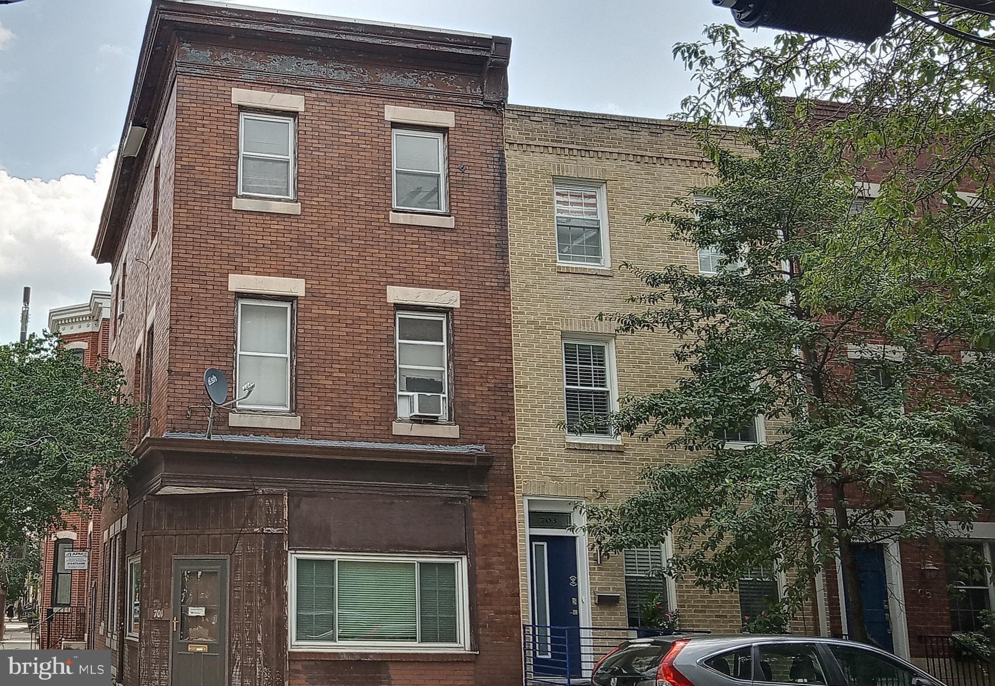 Mixed use, centrally located, corner, three-story property offers an opportunity for renovation to either three stories of residential space or a commercial-residential mix. The first floor has four different egresses. The egress accessible from the rear of the building leads to a stairwell to the upper floors, making for good separation between the living and commercial areas. The second floor has two bedrooms, one of which is over-sized, and a full bathroom with a shower (no tub). The third floor has three rooms, a walk-in closet, and a full bathroom with a tub. Many of the upper-floor rooms at this southeast corner get great sunlight. The full basement contains a bilco door onto Bainbridge Street. The flat roof affords a great view of the Center City skyline. The building is perfect for a neighborhood store or coffee shop with living spaces above. Sold 'as is'. Seller may leave some items.