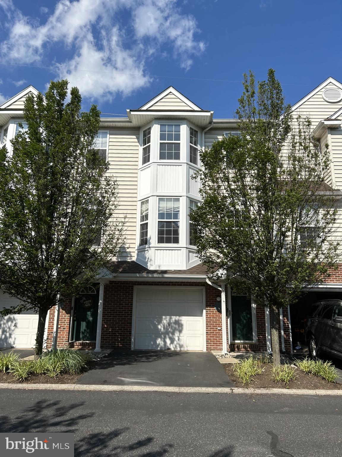 Come see this beautiful 3BR/2.5BA townhome in the desirable River Walk community, nestled in the award-winning Spring-Ford School District. Enter at ground level through the front door or attached garage into a welcoming foyer with a coat closet and a spacious bonus room—perfect for a home office, playroom, or extra storage. This 1,800+ sq. ft. home features an open-concept second floor with updated flooring, 9 ft. ceilings, and a private rear deck—ideal for relaxing or entertaining. The third floor includes the laundry area with a washer and dryer for added convenience. The garage is equipped with an electric car charger, Home will be professionally cleaned and move-in ready by 8/15. Community amenities include snow and trash removal, landscaping, mulching, a pool, game room, and a fitness center. Enjoy access to hiking trails and a canoe/kayak launch along the scenic Schuylkill River. Conveniently located just minutes from downtown Royersford, Collegeville, Phoenixville, and Valley Forge. Walking distance to Riverfront Park, Main Street, public transportation, and only minutes to Route 422, premium outlets, restaurants, and shopping.