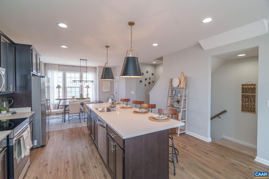 Immediate Move-in This beautifully designed 3-level townhome offers over 1,850 sq. ft. of finished living space and a 1-car garage. With 3 bedrooms, 2.5 baths, and thoughtful upgrades throughout, there?s plenty of space for everyone.  The mid-kitchen layout is perfect for entertaining, featuring a 9-foot island, 42" cabinets, granite countertops, cabinet pantry, and stainless steel appliances.  Upstairs, the owner?s suite offers a private retreat with dual vanities, a step-in shower, and a large walk-in closet. Finished bedroom and full bath on first level.  All bathrooms and the laundry room are finished with upgraded ceramic tile, while LVP flooring enhances the foyer, kitchen, family, and dining rooms. A security system is included, and the HOA provides lawn care for low-maintenance living.  Photos may contain options that are not standard on all models or not an included feature. Pictures and virtual tour are of a model home and show optional upgrades  Ask about current incentives available with use of our preferred lender and title company!,Granite Counter,Maple Cabinets