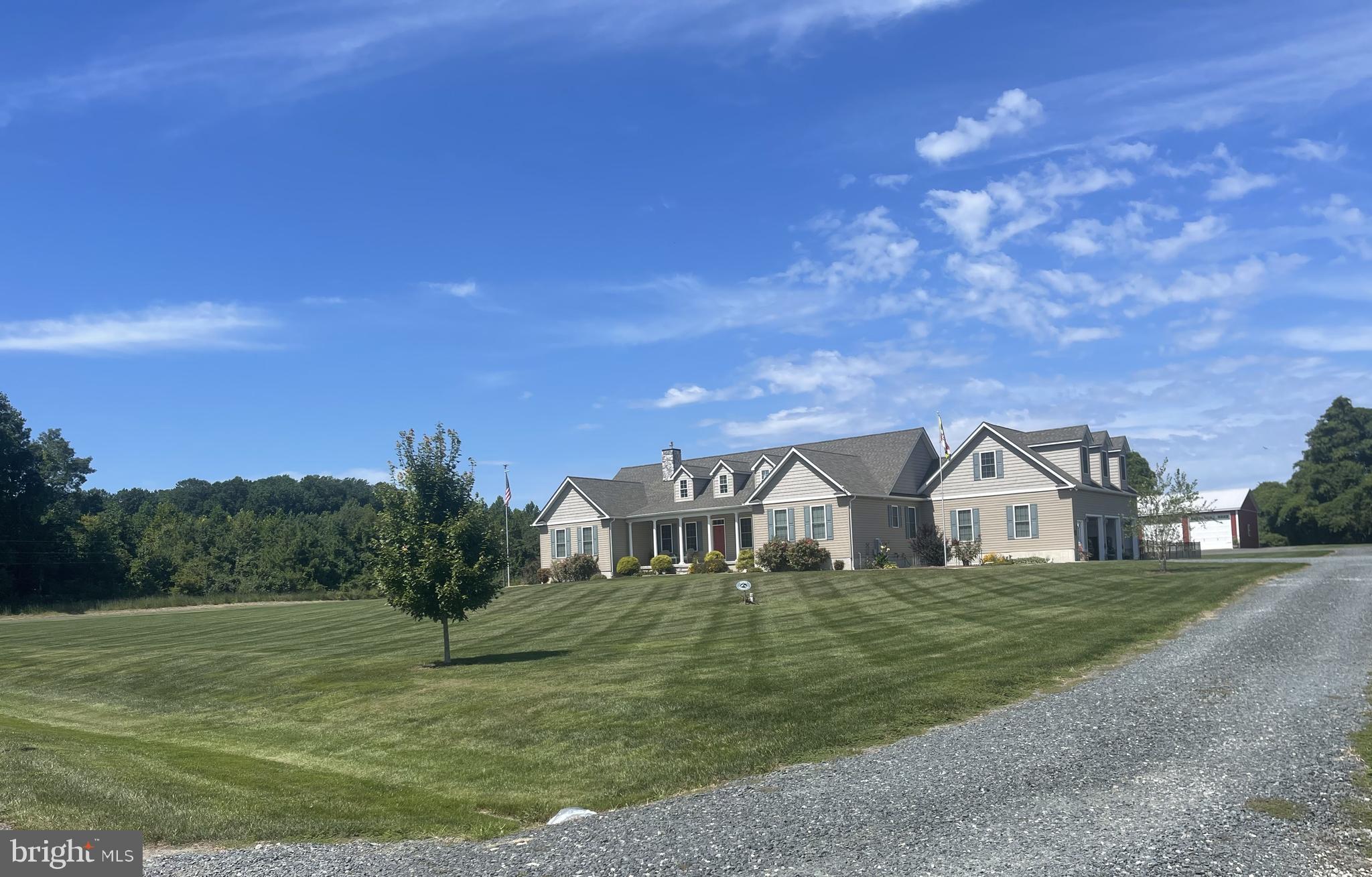 Professional Photos Coming Soon. Discover this beautiful custom designed and custom-built home. Perfectly situated on over 3.5 tranquil acres in a country setting yet close to conveniences. Offering one-level living at its finest, this home features 3 spacious bedrooms, each with its own bath, a home office, half bath, and main level laundry/mud room. The open design showcases cathedral ceilings in the living room and primary suite, a floor to ceiling stone gas fireplace, and luxury vinyl plank flooring throughout. The gourmet kitchen is the heart of the home with white shaker cabinets, a large quartz island with prep sink, quartz countertops, gas stovetop, electric oven, and stainless steele appliances. The primary suite offers a spacious private retreat with two walk-in closets, an amazing primary bath with tiled walk-in shower, dual shower heads, and dual sink vanity. Additional highlights include a spacious 3.5-car garage with epoxy-coated floor, an unfinished bonus room above, AND an unfinished basement with sprinklers—rare and ideal for future living space or storage.
Enjoy the scenic outdoors with a covered front porch, fenced backyard with stamped concrete patio, and a 40x40 pole building with concrete floor, electric, and lighting—perfect for hobbies, storage, or workshop needs.
This home blends modern comfort with country charm, offering the comfort, privacy and space you’ve been looking for.