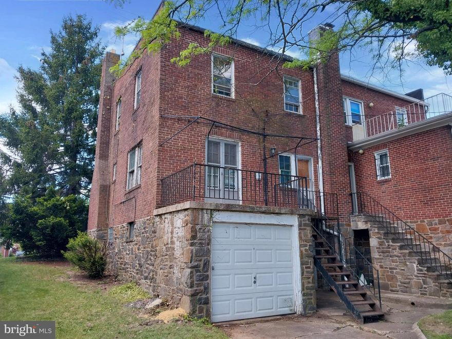 This huge three bedroom and two full bathroom on upper level all brick and stone duplex end unit with historic pennsylvania slate roof has great potential. The hardwood floors can easily be refinished. Two woodburning fireplaces and a rearload garage.