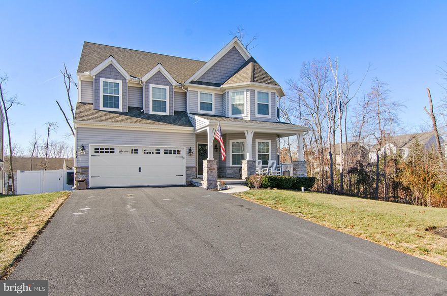 Stunning home in the Cool Springs at Charlestown Community!  This home still looks and feels like new construction and is available for immediate occupancy.  This is the Covington model by Keystone Custom Homes and features the desirable "Heritage" elevation with great architectural style and covered entrance porch.   The floor plan feels open and spacious thanks to large room sizes and tons of natural sunlight.  There is an entry foyer and main hallway with access to first floor office, half bath, dining room, then into the large and open family room with adjoining gourmet kitchen.  The kitchen features 42" white cabinets with white quartz counters, a farm sink, great light fixtures, an oversized island with counter seating and stainless steel appliances.  There is a large breakfast room with sliding doors to rear yard.  Plenty of storage in the kitchen thanks to the large walk-in pantry plus a convenient mudroom with closet and access to the garage right next to the kitchen.  The entire main level has maintenance free LVT flooring.  The upper level features a large hallway into four spacious bedrooms and a second floor laundry room.  The primary suite is a large main space with two closets, full bathroom with double vanity.  The other three bedrooms are also very spacious and share the hall bathroom.  The lower level is large, has high ceilings and is ready to be finished into anything you can imagine.  The entire rear yard is fenced with a white vinyl privacy fence.