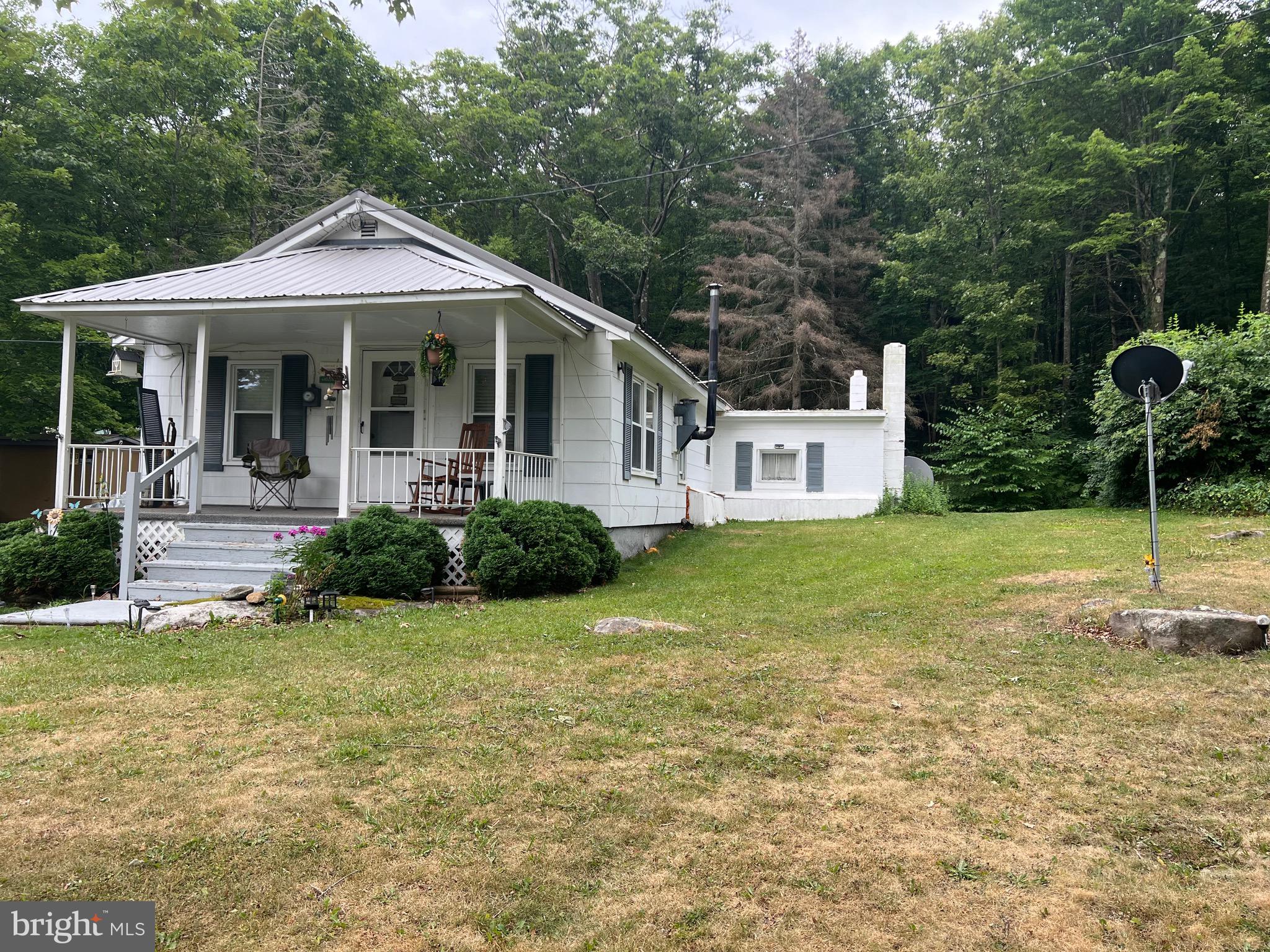 Great starter home on just under 10 acres waiting for you to call home. Home has 2 bedrooms and 1 bath and plenty of potential. Sit on the front porch and breathe in that clean mountain air or take a nice stroll through your private woods. Priced to sell so don't delay and call today..