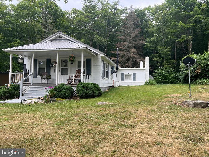 Great starter home on just under 10 acres waiting for you to call home.  Home has 2 bedrooms and 1 bath and plenty of potential.  Sit on the front porch and breathe in that clean mountain air or take a nice stroll through your private woods.  Priced to sell so don't delay and call today..