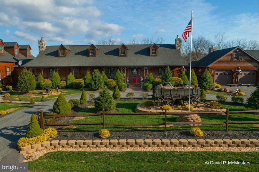 Log sided Fantasyland  on the Opequon Creek. Huge finished bsmt, huge indoor htd swimming  pool w/large stone fireplace, 15 htd garage spaces, many outbldgs, roofed amphitheater for shows or parties, barn and fenced areas for animals ( bring the chickens and your horse to join the ducks and donkey and others now present), 2 story children's playhouse, massive decks, balcony, gazebo, firepits, hot tub, sauna .Main floor master suite w/sitting rm. Lower level has apartment, huge recreation area and sauna. Walkways sidewalks, great landscaping, creek front. Great location between  Shepherdstown, Martinsburg and Charles Town. Backs to the Opequon Creek, which is stocked and easily kayakable. Maybe a retreat. The square footage measurements  for this property  are estimates and include the indoor swimming pool room and the 3rd floor living space above the garage.HUGE PRICE DROP   It's an incredible value in excellent condition.