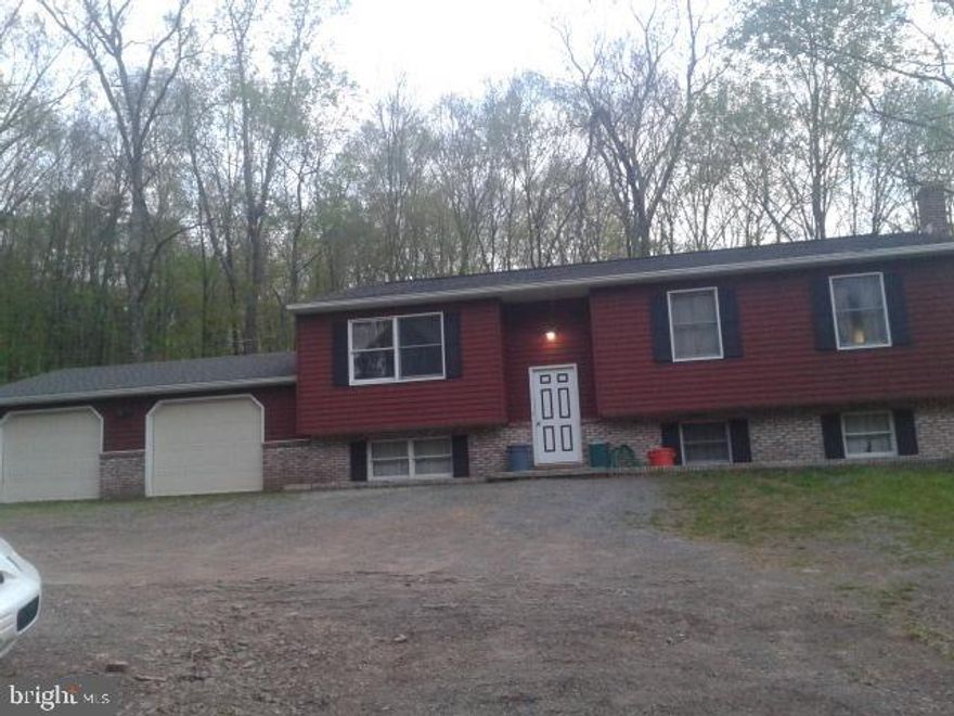 Home Being sold "As-IS", needs some TLC.  Great opportunity for that DIY person looking to enjoy a country setting on their 4+ acre lot.  Over-sized garage is perfect for all your outdoor toys and vehicles.