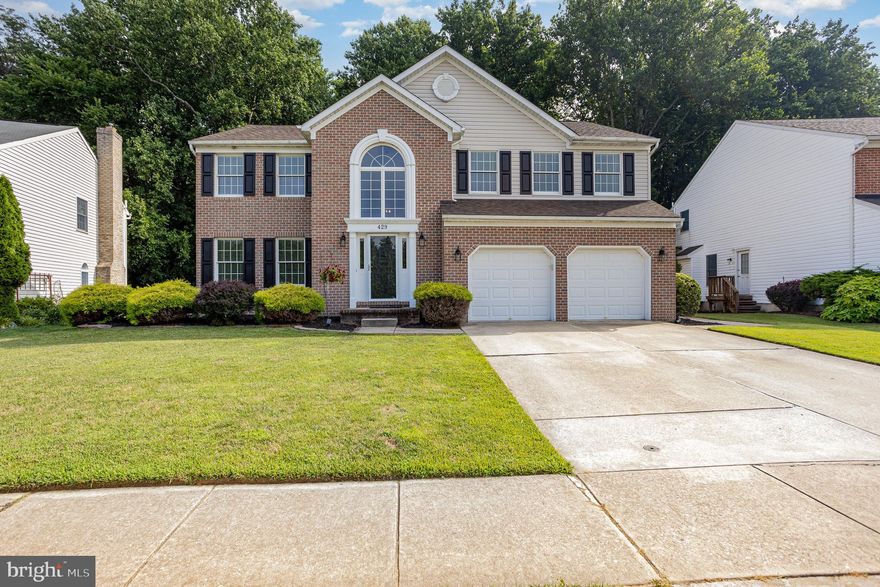 This updated colonial with four bedrooms and four bathrooms backs to 10 acres of woods and feeds to the Patterson Mill school district. Inside, you're greeted by a two-story foyer and refinished hardwood floors throughout the main level with neutral paint and moldings that accent the space. 
The laundry room/drop zone is situated on the main level for added convenience with a side door to the exterior. You'll find a formal living room and dining room - either would work well for a home office. The eat-in kitchen has white cabinetry, granite counters, backsplash, stainless steel appliances, center island and breakfast bar. The family room has a gas fireplace, creating a cozy feel. Upstairs, the spacious primary suite has a cathedral ceiling, sitting room, huge walk-in closet and attached super bath. There are three additional bedrooms - each with a large closet - and a hall bathroom with double sinks to complete the upper level. The lower level is also finished with plenty of entertaining space with a rec room, spare room - perfect as a guest room, full bathroom and more storage. There is a two-car garage with additional storage.