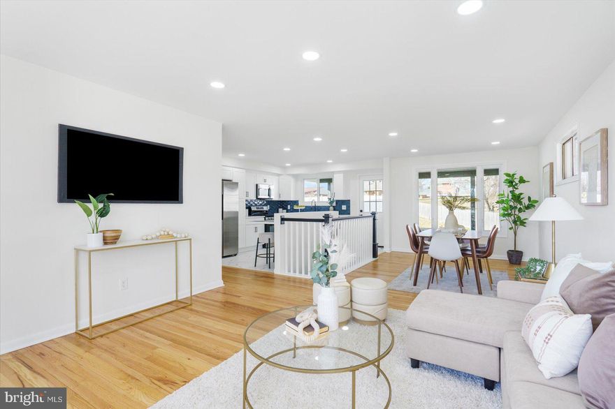 Located in the desirable Greenview community and conveniently close to major commuter routes, this fully renovated rancher offers exceptional space, flexibility, and modern efficiency. The home features 5 bedrooms, 2 full bathrooms, and a versatile bonus room that can easily function as a 6th bedroom, home office, or guest suite, making it ideal for today’s evolving lifestyle needs.

The open-concept main level is highlighted by gorgeous hardwood floors throughout and a beautiful bay window that fills the living space with abundant natural light. The thoughtfully updated kitchen serves as the heart of the home, complete with quartz countertops, stainless steel appliances, gas cooking, and a breakfast bar/island—perfect for casual dining, morning coffee, or evening cocktails while entertaining family and friends.

The finished lower level dramatically expands the living space, offering brand-new carpeting, a stylish bar area, and a cozy gas fireplace—ideal for movie nights, game days, or hosting guests. This level also includes additional bedrooms and a second full bath, providing excellent flexibility for multi-generational living, guests, or private work-from-home space.

Outdoor living is just as inviting, with a large rear patio overlooking a spacious, flat backyard, perfect for outdoor gatherings, play, or relaxation. An attached carport adds everyday convenience, while the owned solar panels enhance energy efficiency and help reduce utility costs, offering long-term savings and peace of mind.

Move-in ready and thoughtfully upgraded, this Greenview home seamlessly combines modern updates, flexible living space, energy efficiency, and an excellent commuter location—making it a truly exceptional opportunity.