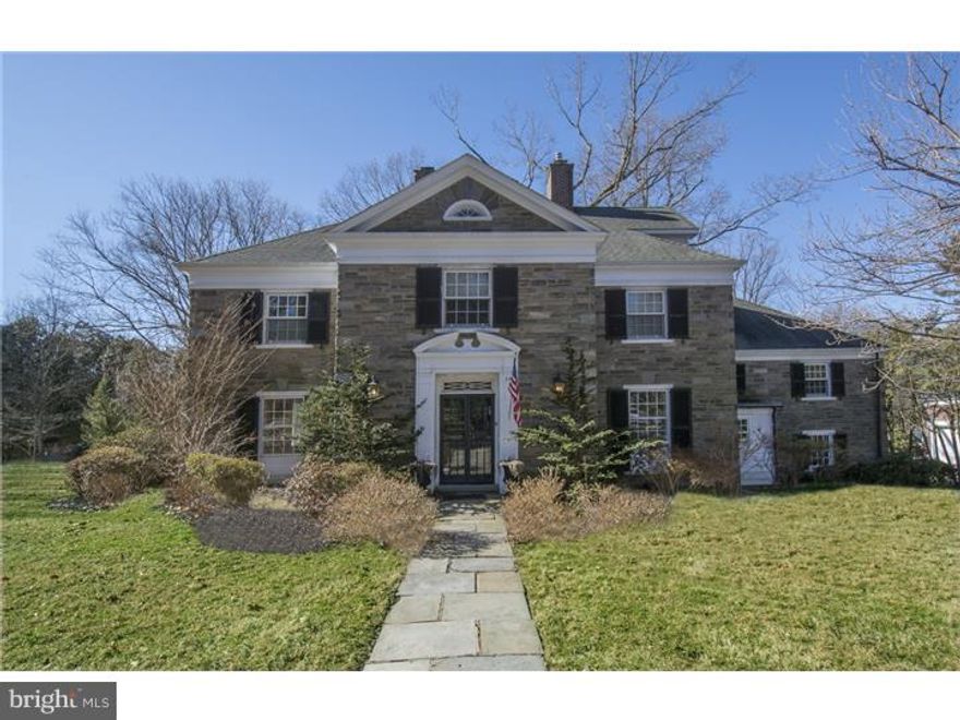 Balanced, classic and light filled, this six bedroom stone colonial home is located on a  large flat parcel on desirable Beech Hill road surrounded by mature trees and enhanced by tiered stone terraces ideal for large scale entertaining. Walking distance to trains and schools, the home offers the quality imparted by 1930's craftsmanship with the recent interior additions and improvements to kitchen and baths. Finished on four levels this home pairs gracious formal spaces with open informal gathering areas including a family room with fireplace connected to the kitchen and large heated and enclosed porch located in the rear of the house which enjoys uninterrupted views of the property's rear and side yard.  A magnificent Master Suite offers privacy and expanded living with large seating area, generous walk-in closet and deluxe Master Bath with fireplace, jetted tub, double vanity sinks and large seated shower.  Five additional family/guest Bedrooms one currently purposed as a home office and Baths are detailed with hardwood flooring, deep base boards and beautiful mullioned windows. Just what the market has been hoping for, a handsome and exceptional property.