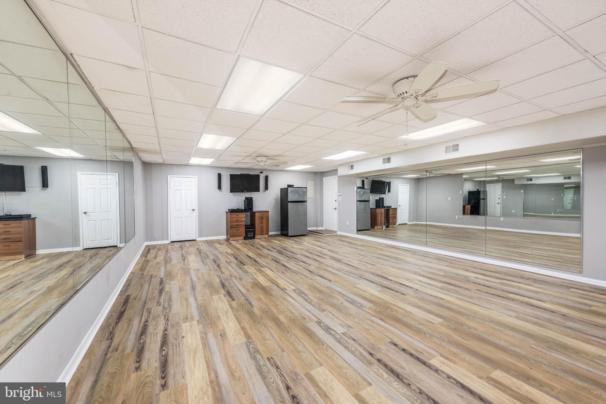 GROUND LEVEL COMMERCIAL SPACE IN A HIGHLY VISIBLE AND CONVENIENTLY LOCATED BUILDING! Space is ideal for a dance or yoga studio or small retail or office space and features wood laminate flooring, an open space with a small kitchenette, a full bath, and central AC and heat. Located in a newly remodeled building with ample parking and perfectly located minutes from 695 & 95! Triple Net Lease with monthly CAM of $300/mo. Minimum lease term of 36 months. Must have good credit to be considered.