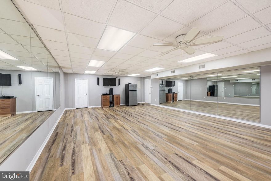 GROUND LEVEL COMMERCIAL SPACE IN A HIGHLY VISIBLE AND CONVENIENTLY LOCATED BUILDING!  Space is ideal for a dance or yoga studio or small retail or office space and features wood laminate flooring, an open space with a small kitchenette, a full bath, and central AC and heat.  Located in a newly remodeled building with ample parking and perfectly located minutes from 695 & 95! Triple Net Lease with monthly CAM of $300/mo.  Minimum lease term of 36 months.  Must have good credit to be considered.