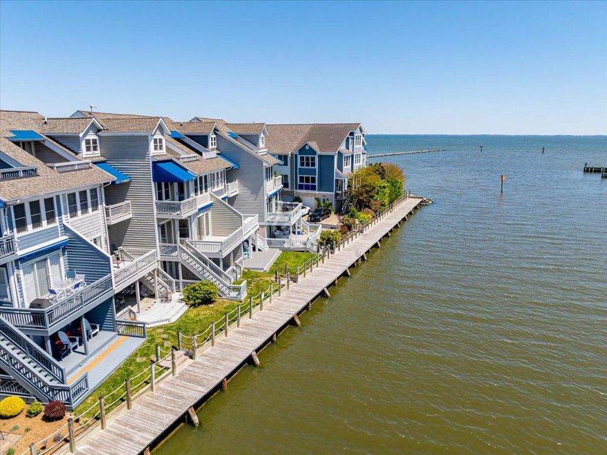 Nestled along the tranquil shores of Chesapeake Beach, this stunning four-bedroom, four-and-a-half-bath waterfront townhome offers 2,632 square feet of thoughtfully designed living space for those who appreciate the beauty of life on the water. Expansive decks on every level provide uninterrupted views, where you can savor gentle breezes and watch local crab boats set out at sunrise.  Also, the home has 2 brand new HVAC systems, new carpet and has been freshly painted.  Move right in and start enjoying your new beach life! Because of its location within the community, you can also sit on any one of your decks and catch all the summer concerts, for free, being held in the resort's bandshell directly across the creek.  This is also the perfect location to catch the famous, Chesapeake Beach, 4th of July fireworks without ever leaving home. 

Residents enjoy exclusive access to a private community beach, beach side pool, pickleball courts, and even has a marina (marina slips are extra and are not deeded to the unit)—creating an effortless blend of leisure and coastal charm.  Whether you are launching a kayak right outside your backdoor or taking a scenic hike along Chesapeake Beach's Old Raildroad trail or shark tooth hunting on the beach, there are endless possibilities.  Whether you dock your own boat at the Rod &Reel or Marina West, or hire a charter, world class fishing and crabbing are just footsteps away. You can also walk to the Rod & Reel Resort and all it has to offer, as well as other in-town restaurants and shopping within Chesapeake Beach.  Within walking distance of Windward Key are multiple marinas. Pull your boat up to the boardwalk, right outside your door, to load it up and enjoy life on the bay!  Whether you’re seeking a peaceful weekend retreat or a full-time sanctuary, only 45 minutes from Annapolis and less than an hour from Washington, DC, this exceptional home offers an inviting opportunity to experience refined waterfront living at its finest.