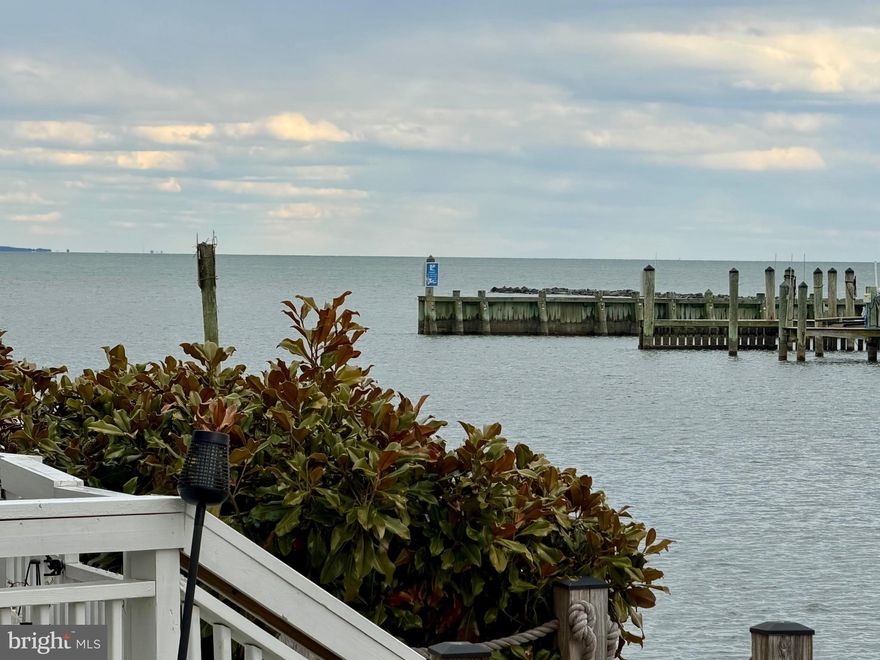 Nestled along the tranquil shores of Chesapeake Beach, this stunning four-bedroom, four-and-a-half-bath waterfront townhouse offers 2,632 square feet of thoughtfully designed living space for those who appreciate the beauty of life by the water. Expansive decks on every level provide uninterrupted views, where you can savor gentle breezes and watch local crab boats set out at sunrise.  Because of its location within the community, you can also sit on any one of your decks and catch all the concerts, for free, being held in the spring and summer at the Rod & Reel Bandshell.  This is also the perfect location to catch all of the famous, Chesapeake Beach, 4th of July fireworks without every leaving home. 

Residents enjoy exclusive access to a private beach, pool, tennis courts, and even has a marina (marina slips are extra and are not deeded to the unit)—creating an effortless blend of leisure and coastal charm.  You can also walk to restaurants and shopping within Chesapeake Beach.  Whether you’re seeking a peaceful weekend retreat or a full-time sanctuary, this exceptional home offers an inviting opportunity to experience refined waterfront living at its finest.