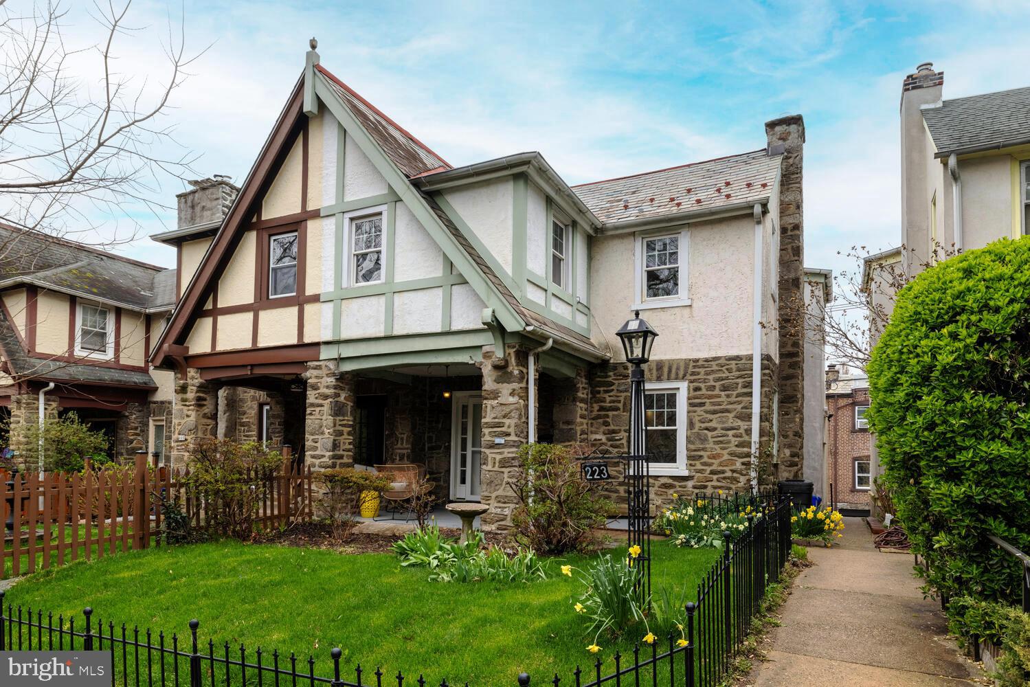 Welcome to West Mount Airy and one of the neighborhood's most popular streets, West Durand! #223 is a stone end-of-row beauty with a welcoming front porch overlooking it's manicured yard. Step into the living room from the front porch and enjoy the open concept of this lovely home. With refinished hardwood floors and fresh paint, this room opens into the dining room and kitchen area providing a bright gathering space. The living area features a brick fireplace with wood mantle plus a ceiling fan. The dining area has a mini split air conditioner that services the whole of this level for the warm days ahead. The kitchen features a gas range and dishwasher as well as granite countertop and oak cabinetry. The powder room is conveniently located for your guests' visits. Upstairs you'll find a refreshed hall bath with a shower over tub, new toilet and sink, flooring and paint. Three bedrooms, all with hardwood floors and ceiling fans offer ample closets and lots of light. There is a hall linen closet as well. Travel to the basement where you'll find a wonderful flex space, finished for work or play. There is also a nice sized storage room and a mud room with laundry hook ups and a utility sink. Step out from here to access the attached garage or enjoy the delightful yard that hosts a retractable laundry tree for breezy days ahead. This Mt Airy home is a walking distance to the commuter line and lots of local shops.