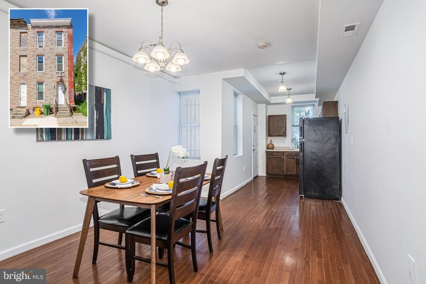 Fully renovated MOVE IN READY END OF GROUP ROWHOME WITH 3 FINISHED LEVELS AND LARGE ROOM SIZES! All new electric, new central A/C, new plumbing, new drywall and fresh paint.  Property was renovated with permits and sign offs.  Features include hardwood floors throughout, main level with a spacious living room, separate dining room, and kitchen with ample cabinet space.  Private, large Master bedroom has loft-like feel with its private 3rd floor location, 10' ceilings, recessed lights and walk-in closet.  2nd floor has 2 large bedrooms, laundry, and a full bath with dual sinks.  Unfinished basement perfect for storage. Quiet rear fenced patio and very quiet area.  Conveniently located close to 83 and downtown Baltimore!