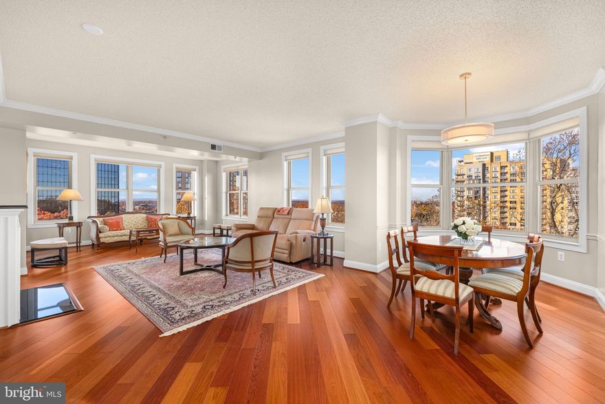 The Luxurious Stratford House... Unit 907 features sweeping skyline, sunset, and city scape views with an ever-changing palette of glorious light in every room!  The expansive living room contains two sitting areas and/or additional space for an office,  myriad windows and gas fireplace. A designated dining area flows into the updated granite kitchen with perfect breakfast area in bay replete with more unobstructed views. An expansive primary bedroom en suite and a versatile 2nd bedroom with full bath completes the main level.  This unit has been lovingly maintained and upgraded with hardwood floors, white-on-white cabinetry, granite counters, custom lighting, window shades, in-unit laundry and  freshly painted throughout. Building amenities include a designated garage parking space, extra storage, workout room, party room, front desk concierge, and a beautiful outdoor pool. Enjoy close proximity to adjacent W&OD trail, stroll to Reston Town Center, Metro, myriad shopping +restaurants and easy access to Dulles Airport. This unit is the perfect choice for today's discerning buyer who demands location, move-in condition and true value.