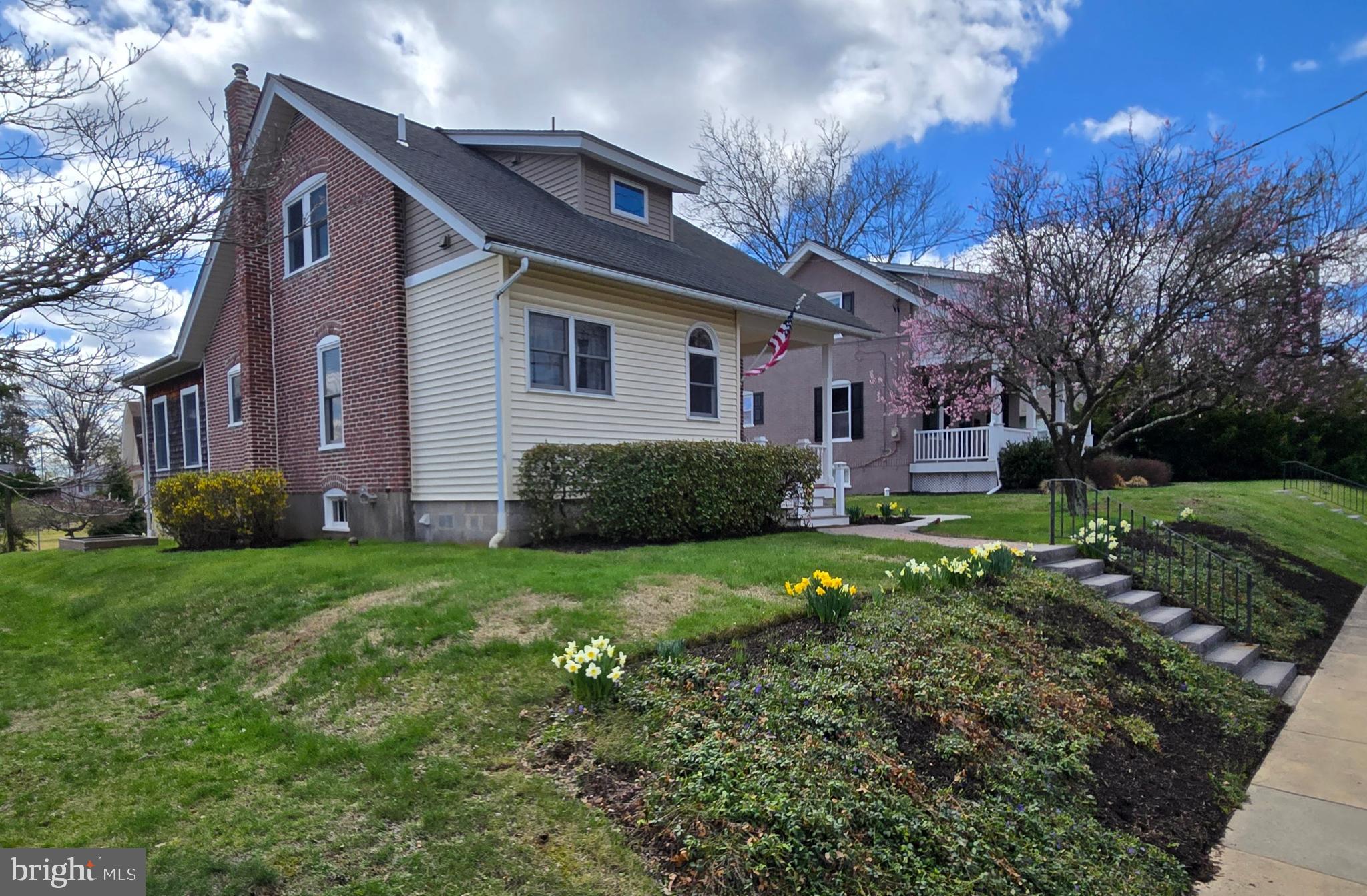 This beautiful Perkasie Boro Cape Cod has been updated and maintained with meticulous attention to detail. You'll be impressed when you come and see all of the work that has been lovingly done to this home. The sellers raised their family here and added value over the years with each addition, repair and remodel. Inside and out you can see the care applied in transforming this house into a home. Up the stone stairway to the covered Front Porch, enter the foyer and then through the 15 pane full lite door into the Living room. You'll notice the seamless blending of old world charm and modern functionality. Hardwood floors, new windows, columns and built ins. There is a modern Kitchen, Charming Dining Room, the doors to a Bedroom on this level were removed & it has been converted to an Office, along with a half bath sporting a stackable laundry that could be converted to a shower to give you a full bath. And lastly, at the rear there is a Spacious Family Room addition w/cathedral ceilings and abundant windows to allow natural light to spill throughout the space. This room is heated with a gas stove and has access to the rear paver patio w/pergola overlooking your garden area and the beautiful landscaping around the perimeter. In the rear there is an oversized garage/workshop with 2nd floor storage. It has a 100A sub panel and was used as a wood working shop over the years. Great space for projects. There is an unfinished basement that will allow for more workshop and storage. Up on the 2nd floor you'll find the other 2 bedrooms & a full bath w/Jacuzzi tub. Newer windows, roof, heating/Central Air, upgraded electrical, and so much more. You're right in the walkable district of Perkasie Boro and all that it has to offer. Restaurants, shopping, festivals and more. Come and see it right away. You'll be happy to call this home.