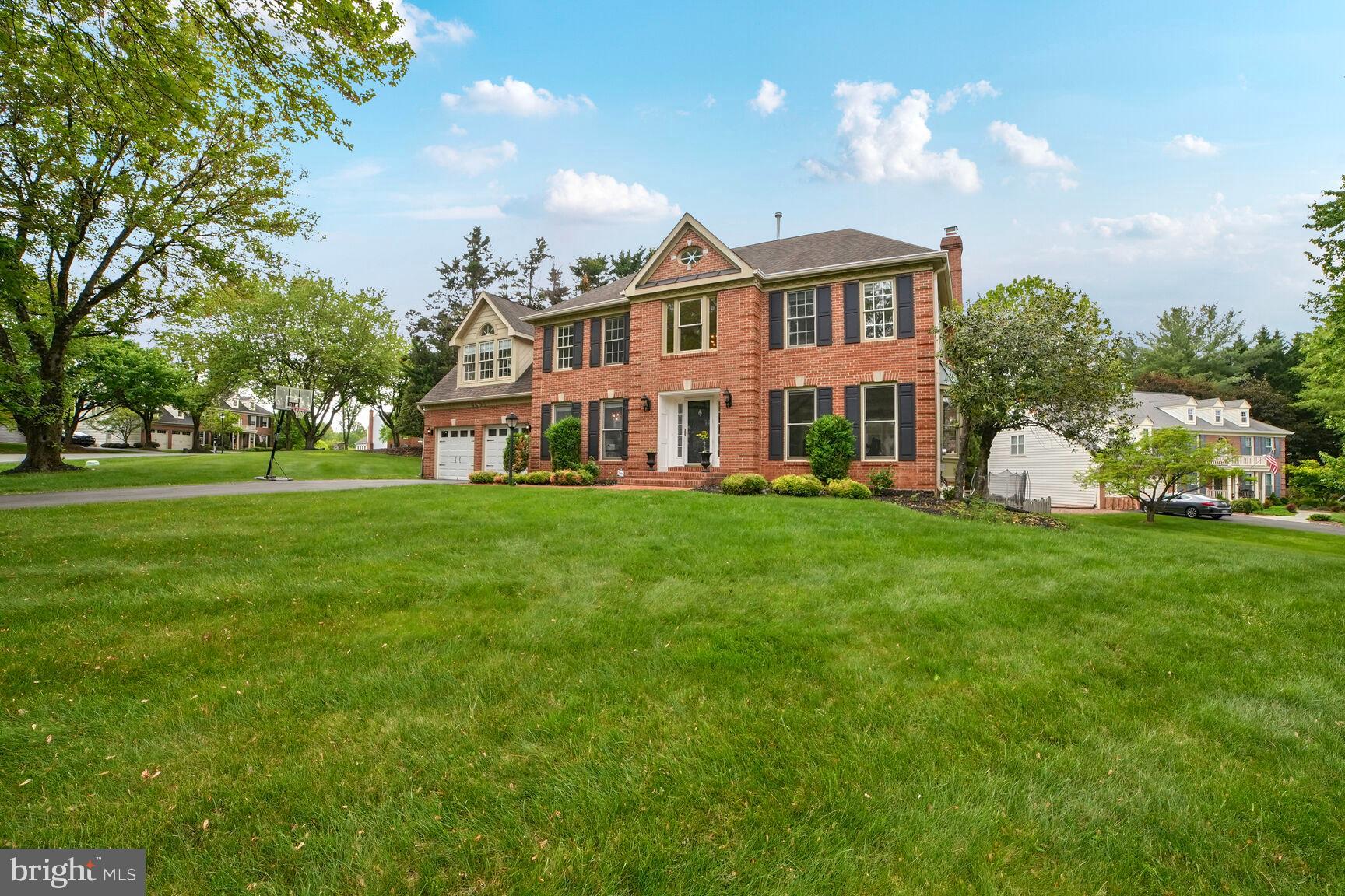 Welcome to 4533 Minuteman Drive, an elegantly renovated colonial-style residence in Rockville, MD, where sophistication meets modern comfort. This splendid home offers an expansive 3,720 square feet of refined living space, set on a generous 18,910 square foot premium lot, backing onto tranquil wooded views, ensuring privacy and serene living.
Step inside through the striking two-story foyer that sets the tone for the bright and open floor plan, adorned with sundrenched windows and strong moldings. Gleaming hardwood floors lead you to the spacious living room, where a charming bow window invites natural light to fill the space. Adjacent is the formal dining room, featuring exquisite box wainscoting, ideal for hosting elegant dinners.
The heart of the home, a gourmet eat-in kitchen, boasts sleek stainless steel appliances, including a cooktop and range hood. Ample cabinetry, marble countertops, a center island, and a cozy casual dining area complete this dream kitchen. The adjoining family room, highlighted by a warming fireplace, provides a seamless flow for entertaining or relaxation.
The expansive sunroom, with its lofty windows and cathedral ceilings, offers an inviting space with easy access to the deck, perfect for indoor-outdoor living. The master suite serves as a serene retreat, featuring soaring ceilings, two generous walk-in closets, and a luxurious master bath.
The upper level offers three additional generously sized bedrooms and a full bath, ensuring ample space for family and guests. The lower level surprises with a recreation room, a dedicated game room, and a full bath, alongside ample storage space.
Step outside to discover beautifully landscaped grounds, a brick-covered front porch, a custom patio, and a fenced backyard, all designed to enhance your outdoor experience. Security features are thoughtfully included for your peace of mind.
This magnificent home is truly a must-see, offering a harmonious blend of classic design and modern amenities. Don't miss the opportunity to make 4533 Minuteman Drive your new address.