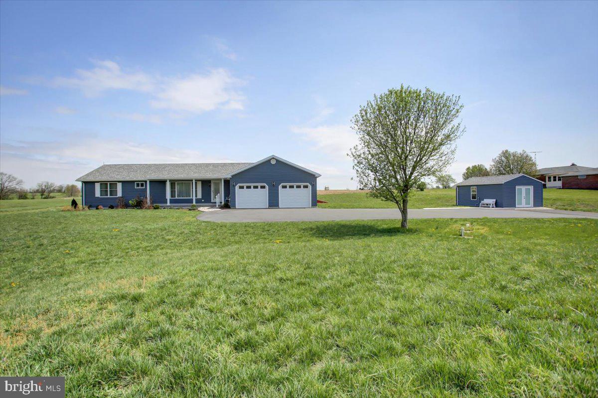 Welcome to your dream home, a charming rancher nestled in the serene countryside with stunning mountain views. Built just a few years ago, this house combines modern comforts with the tranquility of rural living.
As you step into the front living room, you're greeted by a large bay window that frames the picturesque mountain scenery, inviting you to relax and enjoy the view. The house features two spacious bedrooms, but there's also a cozy den that could easily be transformed into a third bedroom, offering flexibility for your needs.
The hardwood floors throughout the home add warmth and elegance, leading you to the heart of the house—the modern kitchen. Equipped with quartz countertops, a stove, microwave, dishwasher, and refrigerator! A kitchen island with bar stools and a lazy susan are also included! The kitchen offers a beautiful view of the farm fields in the backyard, making meal preparation a delightful experience. The stove is versatile, allowing you to choose between gas or electric cooking.
The primary bedroom is a true retreat, boasting a huge walk-in closet and an ensuite bathroom designed for comfort and accessibility. The bathroom features a handicap accessible shower with a bench and grab bars, ensuring safety and convenience.
The second bedroom is very spacious and features large windows with beautiful views, lots of natural light, and a large closet!
There is also a laundry room conveniently located on the first floor and equipped with a washing machine, clothes dryer, sink, and storage closet.
Storage is abundant throughout the home, with ample space to keep everything organized. The basement is a standout feature, with 9' ceilings, poured walls, a water filtration system with UV light and aeration, and a high-efficiency water heater. There is also a radon mitigation system already in place!
Outside, the front porch is made of concrete and features a stone walkway leading to the front door, adding to the home's curb appeal. The expansive back deck, constructed from Trex decking, is perfect for outdoor entertaining and enjoying the beautiful surroundings.
The property includes an attached 2-car garage and an additional shed! The shed features French Doors and three large windows with 50-amp service, making it perfect for a Hobby/Shop. Spanning over 1.25+/- acres, the land is beautifully landscaped and easy to maintain.
For peace of mind, the house is equipped with a whole-house generator, surge protector, and buried electric lines from the pole to the house, ensuring reliable power and protection. Starlink connectivity is already in place for ease of access with internet service!
This home is a perfect blend of country charm and modern convenience, offering a peaceful retreat with all the amenities you need. Close to Whitetail Ski Resort and Golfing! Don't miss the opportunity to make this beautiful rancher your own!