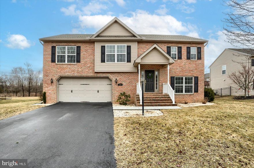 Welcome to this spacious and beautifully designed “Bayberry” raised ranch, offering 2,354 sq ft of comfortable living space with 4 bedrooms and 2.5 bathrooms. The bright and airy main level features a stunning cathedral ceiling in the living room, complete with a cozy gas fireplace—perfect for relaxing or entertaining. The open-concept layout flows seamlessly into the dining area and kitchen, making gatherings effortless.

Downstairs, you’ll find a versatile lower level that includes the fourth bedroom, a half bath, and an additional living area—ideal for guests, a home office, or a private retreat. Step outside to a fenced-in backyard that offers both privacy and space to enjoy the outdoors.

Conveniently located within walking distance to Dillsburg Elementary, multiple parks, the public library, and the heart of the borough—this home offers both comfort and convenience.

Don’t miss your chance to make this lovely property yours—it won’t last long!