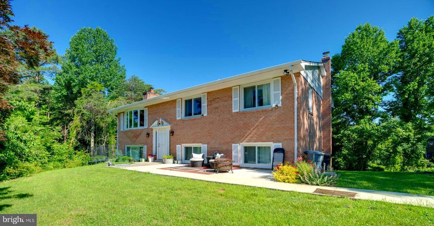 Beautiful split level home on an expansive 3+ acre lot! The lush greenery surrounding your picturesque home provides plenty of room for gardening, play, or relaxation! Enjoy a newer kitchen with gleaming wood cabinets and stainless steel appliances adjoining the dining area. Appreciate a birds eye view of the yard and property from your upper level living room bay window. The main level living quarters feature the master bedroom with en suite full bath as well as additional bedrooms and full bath. The basement level is fully finished with another living room space complete with brick surround fireplace, bedroom, and full bath. The sliding glass doors from the basement living room allow you to walk out to the backyard space of your dreams! Sellers are also able to build a 12x21 Metal Garage onto the concrete pad if you wish! Contact agent for pricing details. Act fast to secure an amazing lot and home.