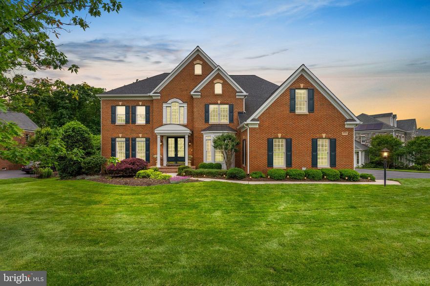 Welcome to Oak Hill Reserve, a prized residential neighborhood of only 83 homes, known for its tree-lined, cul-de-sac streets and large landscaped lots. This Winchester Homes, Randall model boasts a full custom brick facade, and meticulous maintenance by its original owners, showcasing their great attention to detail with thoughtful updates and custom expansions.
Step inside to a grand two-story foyer featuring a custom curved oak staircase, bathed in beautiful natural light streaming through the glass-paned double front doors, large foyer window, and the floor to ceiling windows in the living room. The open and inviting layout flows seamlessly into a spacious two-story family room, with soaring floor to ceiling windows, and a double sided gas fireplace is perfect for both relaxation and entertaining. Tucked beside the family room is the main-level study, which offers privacy for those who telework, study, or love a quiet place to read.
The spacious gourmet kitchen is a chef's dream, featuring a giant center island with a 5-burner gas cooktop, upgraded stainless steel appliances, double wall ovens, a large pantry, and elegant glass-paneled cabinets. Whether you're preparing a family dinner or hosting a gathering, this kitchen is equipped to meet your every need. Elevate your dining experience to a formal dinner in the banquet size dining room, or enjoy a summer barbeque on the expansive rear deck. 
The sleeping quarters of the home are just as gracious with a expansive primary suite, accented with an octagon recessed ceiling, and includes a sitting area, vanity room, and primary bath  featuring separate vanities, 2+ person Jacuzzi garden tub, and dressing room. The remainder of the bedrooms are generous in size with one of the bedrooms having their on ensuite bath, and the other two sharing a dual entry bathroom.
The fully finished walk-out lower level is built to be a haven of fun. Gather around the 10-seat bar and watch your favorite sporting events, or hang by the billiards for a few rounds of pool. The bonus spaces found in this level can be transformed into essential living areas such as an exercise room, 5th bedroom (currently used as an additional home office), music room, or hobby room.
Outdoor and indoor spaces blend harmoniously, offering areas for both formal and informal gatherings. The tranquil solarium provides panoramic views of lush trees, creating a serene retreat within your home. Sited on 0.86 acres, this property is the 3rd largest lot in the neighborhood - extending past the initial row of trees, ensuring privacy and plenty of room for outdoor enjoyment. An invisible fence ensures the safety of your furry family members as they roam freely.
Custom changes enhance the home's functionality and charm, including a 4-foot rear extension to add the solarium and enlarge the finished basement, a 2-foot expansion to the side of the home on all 3 levels, an oversized dressing room/walk-in closet, and a 12x12 laundry chute from the primary suite to the laundry room to ensure optimal convenience. 
Most of the major systems have already been replaced or upgraded, including the roof, gutters, kitchen appliances, HVAC (main level & upper level), and hot water heater, to name a few.
The homes of Oak Hill Reserve are zoned for highly sought-after “A-rated” schools, Crossfield Elementary, Rachel Carson Middle, and Oakton High School, and are ideally located within minutes of the bustling shopping and dining at Reston Town Center and Fairfax Corner, as well as local trails and parks. Easy access to major commuter routes like Rt 50, Rt 66, and Rt 267, the Silver Line Metro, Inova Hospital, and just 5 miles to Dulles International Airport, and approximately 20 miles from Washington D.C. ***CHECK OUT OUR 3D VIRTUAL TOUR FOR VIRTUAL WALK THROUGH***