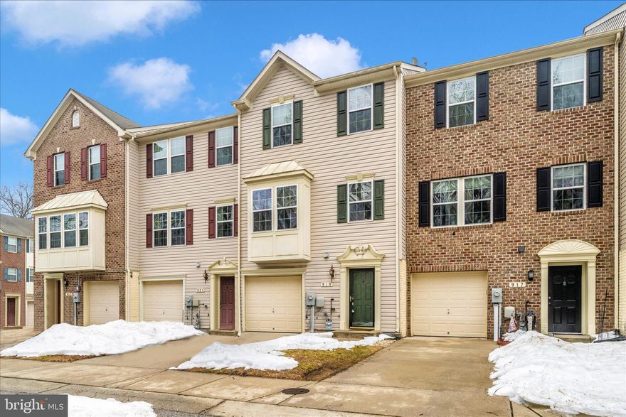 Welcome to this 3-bedroom, 2.5-bath townhome located in the Tanyard Springs community, backing to a wooded setting for added privacy. The main level offers a functional layout with hardwood flooring in the kitchen and laminate flooring in the living and family room areas, providing comfortable space for everyday living. The kitchen features granite countertops, stainless steel appliances, recessed lighting, and a center island with additional storage. The dining area opens to the rear deck, offering a convenient outdoor space.. Primary bedroom includes a walk-in closet and a private en-suite bath. Two additional bedrooms share a full hall bath. Bathrooms are original to the home. The lower level includes new carpet and provides flexible space that can be used as a recreation area, home office, or additional living space. The laundry area is located on this level. Tanyard Springs offers community amenities including a clubhouse, pool, fitness center, playgrounds, dog park, and sports courts. Conveniently located near major commuter routes with easy access to Fort Meade, BWI, Baltimore, Annapolis, and surrounding shopping and dining.
Some photos may be virtually staged to illustrate potential.