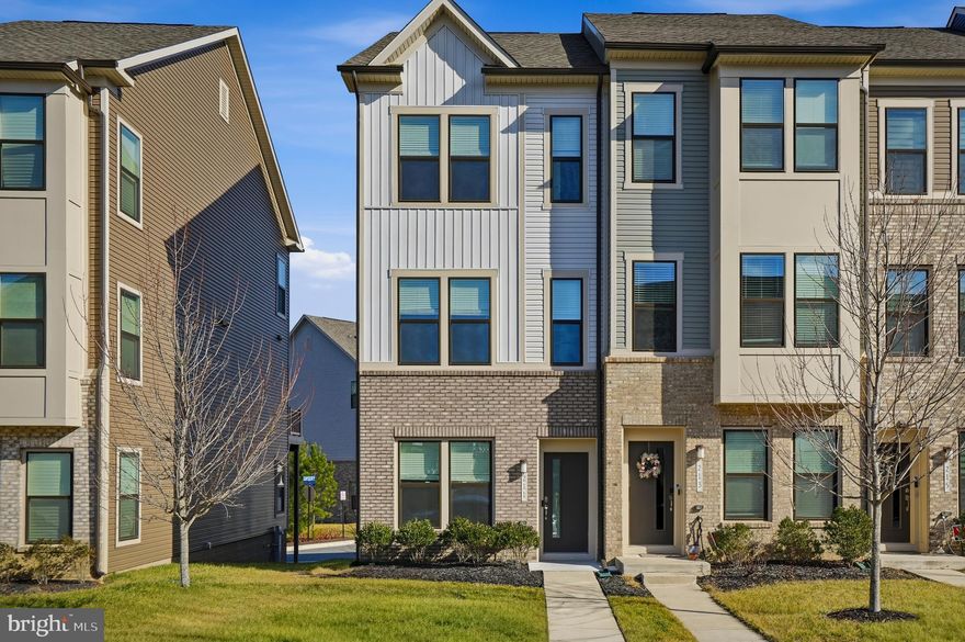 Welcome home to this like-new end-of-group townhome offering modern finishes, flexible living spaces, and incredible community amenities, all in a prime location within the neighborhood! This home is centrally positioned near the pavilion, clubhouse, dog park, and the beautiful pocket park right behind it, making everyday living convenient and enjoyable. As you enter, you’re greeted by LVP flooring and a versatile main-level bedroom, ideal as a guest room, office, or cozy den. This level also includes a full bathroom with a tub/shower combo and access to the garage. Head upstairs to the second level, where you’ll find an impressive open floorplan with high ceilings that create a bright, airy, and seamless flow, perfect for entertaining or relaxing. Host gatherings in the spacious living room, enjoy meals in the dining area, and cook with ease in the beautifully upgraded kitchen featuring tons of cabinet storage, ample prep space, a tile backsplash, quartz countertops, stainless steel appliances, and an island with pendant lighting and bar seating. Crown molding and recessed lighting add a polished, modern touch. A powder room on this level adds convenience for guests. The third floor features two generous bedroom suites. The primary suite boasts abundant natural light, spacious closets, and a private ensuite with dual vanities and a beautifully tiled walk-in shower. The secondary suite includes a walk-in closet and a full bathroom with a tub/shower combo,  perfect for guests or additional family members. Step outside to the rear deck and take in views of the community grounds, an ideal space for summer BBQs or evening relaxation. Parking is effortless with a one-car garage and private driveway. This exceptional community offers a pavilion, fire pit, picnic benches, pocket parks, a tot lot, and a pool, making it easy to enjoy the outdoors. Plus, you’ll love the unbeatable convenience to major highways (32, 295, 95) and nearby shopping, dining, and everyday essentials. With modern living, a highly desirable location, and community amenities at your fingertips, this home truly has it all. Schedule your showing today!