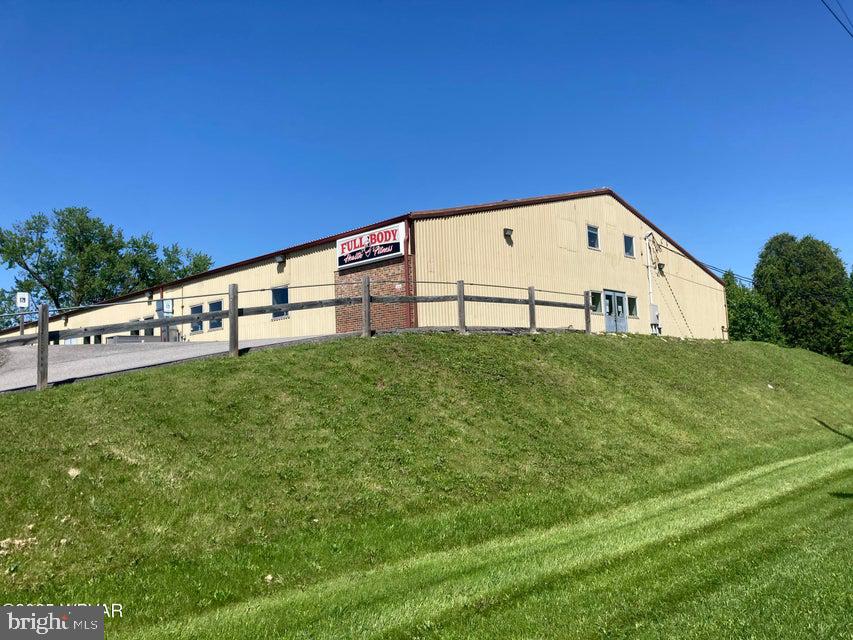 Fantastic opportunity to own a commercial building in a highly visible area in Lock Haven. The 80X160 steel building has premium updates, has been well maintained and is in top condition. Some of the features are: a welcome lobby with cubbies and coat rack; a reception area with a juice bar, a well lit fitness area with ample natural lighting; a large exercise room which is easily seperated into private spaces; men's and women's locker and shower rooms; a laundry area; sound absorbing acustical ceiling panels, fitness bounce flooring, and recessed lighting. There is additional 680 square feet of office space upstairs. .Ideally located close to US-220, I-80 and I-99. A very small portion of the back corner of the land is in flood zone AH