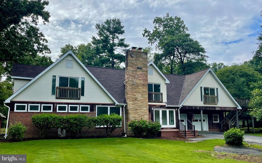 Prepare to be stunned by this beautiful, over 5000 sq. ft., 6 bed, 4 bath home on a half acre lot on a quiet street, minutes from the University of Maryland. The huge main level features a large living room with a stone fireplace, large kitchen filled with natural light, fresh paint and hardwood flooring throughout! The main level also features 3 bedrooms, 2 full baths, and a spacious two car garage. The upper level of this sprawling home features 3 well lit bedrooms, 2 full baths, and a sitting area. The upstairs also features a stunning, self-contained apartment with fresh paint, brand new flooring and is totally plumbed and ready for bathroom and kitchen finishings of your choosing. This unit holds great rental potential for the new homeowner or a makes a phenomenal owners suite! The apartment features ample natural light and a brand new large deck for private access to this separate unit. The house also features a massive basement and storage area with new flooring and paint. The home has a new roof, HVAC system and the sellers just invested in upgraded electrical panels...this place is ready for you and your family to enjoy. With immediate access to major routes (495,295 & 95),  shopping, and recreation areas, make this your new home today! Also close proximity to many popular private schools.