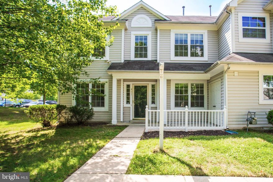 Fantastic end unit townhome ready for a buyer to make it their own. Hardwood floors throughout main level and upstairs. Living room with marble surround gas fireplace. Two master bedrooms upstairs, each with its own full bath. Child's playground within walking distance in one direction and tennis courts within walking distance in the other direction. Good condition. Good Location. Great price!