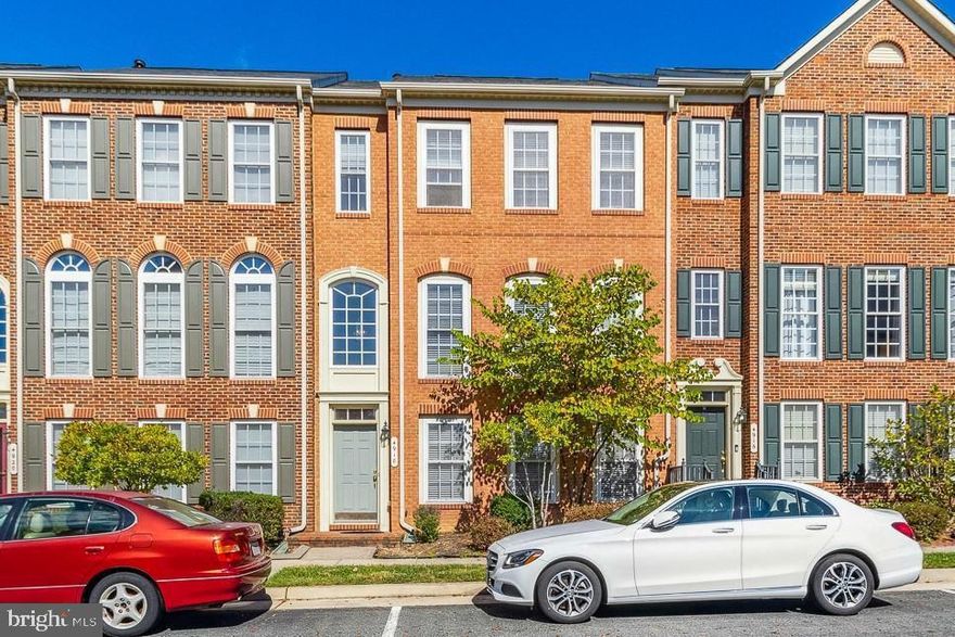 Spacious, bright, and open! Brick front "Carnegie" built by NV Homes in 2005 with 2,712 finished sq ft on three levels! Enjoy 9' ceilings on main level, decorative columns between living and dining rooms! Freshly Painted, Hardwood floors and Corian counters in gourmet kitchen with center island, breakfast bar, gas cooktop, double wall ovens, and side-by-side refrigerator! Owners Suite offers vaulted ceilings, walk-in closet, and deluxe bathroom featuring dual vanities, corner soaking tub, and separate glass shower! Huge ground-level basement boasts two-story foyer, oversized recreation room, 3rd full bath, den, and level walk-out to the back yard. Two-car detached garage and fully fenced rear allow for creativity in future outdoor living by new owners! Great location in the heart of Woodbridge across from the Government Center and close to 95 and Prince William County Pkwy, while just a short drive to Manassas VRE Stations. Plenty of shopping and dining options nearby! The PW County Center community has a clubhouse with fitness center, meeting/party room, outdoor swimming pool, tennis courts, and tot lots/playgrounds!