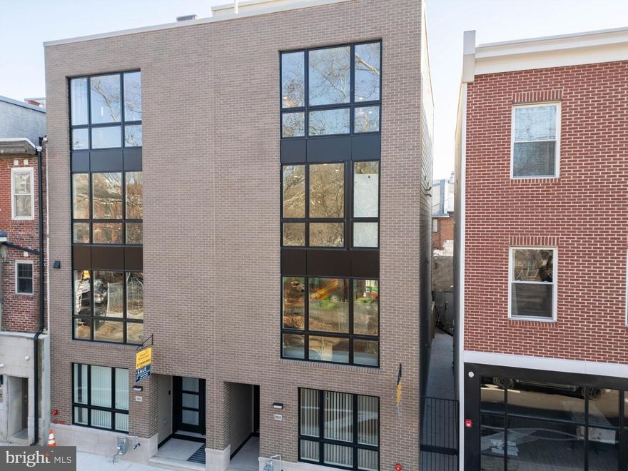 Welcome to contemporary elegance in the heart of Society Hill! This beautiful new construction, boasting a 10-year tax abatement, spans 3500 square feet of meticulously designed living space, seamlessly blending modern aesthetics with meticulous attention to detail.

Step through your private entryway into a grand foyer, setting the stage for sophistication. The front room is thoughtfully designated for your office or den area, while a convenient mudroom with built-in cabinets offers ample storage. A full bathroom and a rear bedroom with backyard access complete the lower level, featuring an elevator for easy access from the lower level to your private master suite.

Ascend the specially crafted floating staircase with glass railing to the second floor, unveiling the ultimate open-concept living space. The expansive kitchen boasts double wall ovens, a stainless steel Thermador appliance package, and a walk-in pantry quartz countertops waterfall. Floor-to-ceiling sliding door leading to a spacious balcony off the kitchen elevate this space. Enjoy a generous living area with custom built-ins, overlooking the park.

The third floor features a grand landing area with a laundry room, linen closet, rear bedroom, hallway bathroom, and a front bedroom with an ensuite bathroom. The fourth floor is a masterfully designed master suite with a custom oversized vanity, standalone tub, his-and-hers shower with a skylight, heated bathroom floors, a fireplace, built-in closet system, beverage cooler. Top-floor skylight providing abundant natural light. A wet bar with a wine cooler leads to a sprawling roof deck with stunning views of the park and city skyline. The roof deck features tile flooring, water supply, light decor, and a speaker system for the ultimate entertaining experience.

The luxuries continue with a fully finished basement that defies the typical basement feel, offering two windows, built-ins, storage space, and a well-appointed kitchen. Throughout the house, enjoy the spaciousness and luxury of white oak engineered hardwood floors. Additional features include a 4-station Sonos speaker system, alarm system, and intercom. 

Conveniently located across from Starr Garden and within walking distance to Washington Square Park, Whole Foods, Acme, and more. A one-year pre-paid parking spot adds the finishing touch to this exceptional property. Don't miss your chance—schedule your appointment today and make this luxurious haven your own!