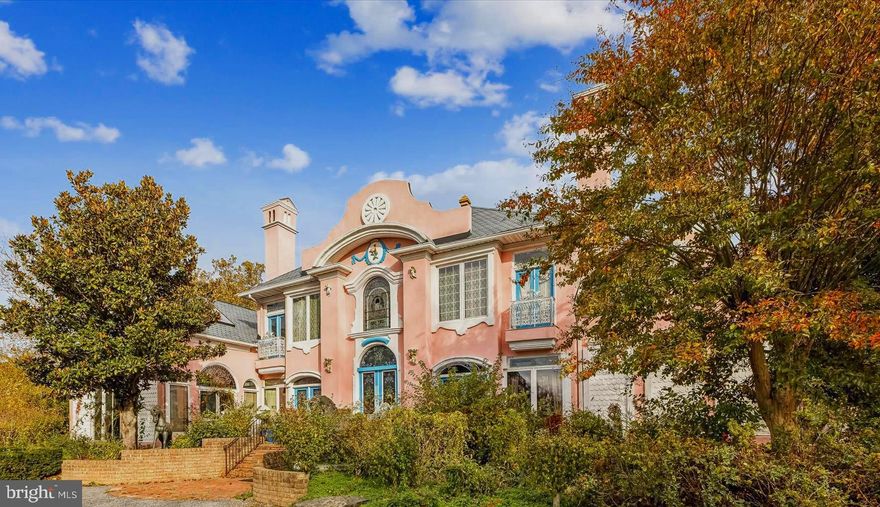 WATERFRONT (20 acres)  located on the Northern section of Kent Island, in the area of larger acreage estates, the "Pink House" provides a peaceful respite from the rush of the world.  As easy 5 minute drive from the Chesapeake Bay Bridge the home offers access to the western shore metro areas.

With over a 1000' of protected shoreline fronting along the broad, open waters of the Chester River the has 100'+ pier offers 4' MLW.    A waterfowl hunter's delight you'll find a blind on the pier and one offshore as well.

A generously proportioned inground pool with an expansive apron for lounging and dining is a focal point between the house and the river.  An outdoor kitchen, huge deck and a screened gazebo invite spending time outdoors.  A conservatory suitable for greenhouse functions or outdoor dining under cover is reminiscent of older European estate gardens.  Established landscaping with unique plants surround the home and outdoor spaces.

The residence is a blend of eclectic flair and flowing functionality.  Designed to maximize views, the generous square footage offers a main level owners suite and three upper en-suites.  Many custom features such as the designer counter tops and backsplash in the kitchen, hint at the uniqueness of this home.

The "Pink House" offers secluded acreage at the end of a tree lined circular driveway.  With some needed renovations and designer touches this home has the potential to be a showplace! 

CRAB this opportunity to own one of Kent Islands finer properties along the Chester River.