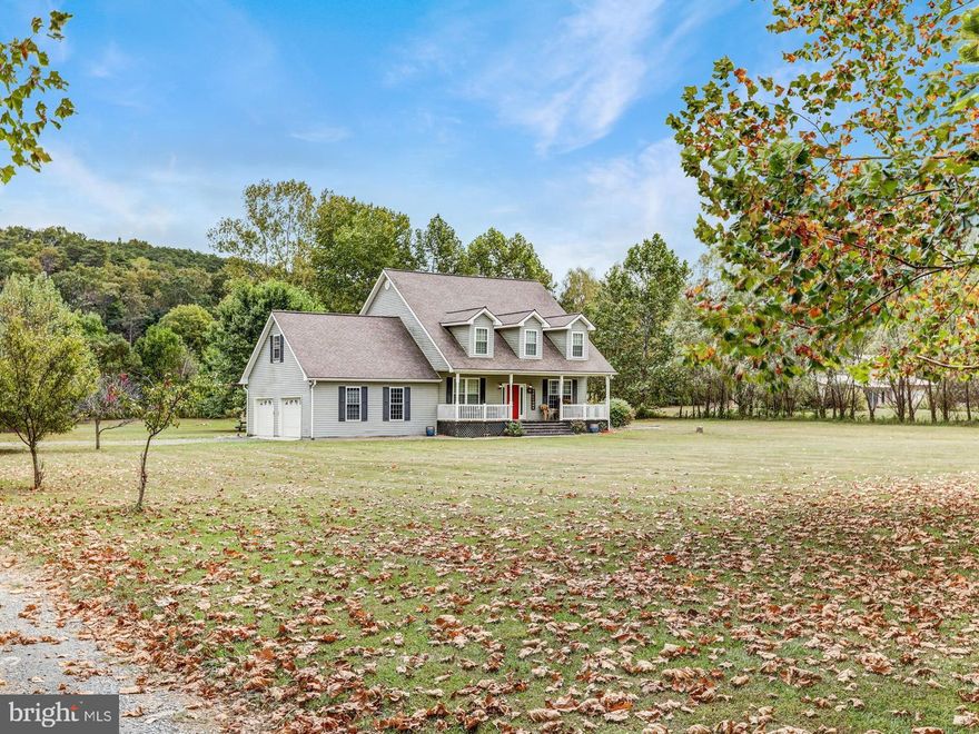 New paint, stain and other updates/repairs since this home was last listed!! Come see this beautiful 4/5 bedroom house on a flat 11.11 acres. Current owners have made it an open floor plan and added amazing hardwood floors and Quartz counter tops. Plenty of entertaining space inside and outside. Spend your evenings on the covered front porch in your rocking chair or enjoy it next to the fire pit on your back patio. The home offers an alternate heating source with an outdoor wood burner. Don't let this one slip by. Call to schedule your appointment today.