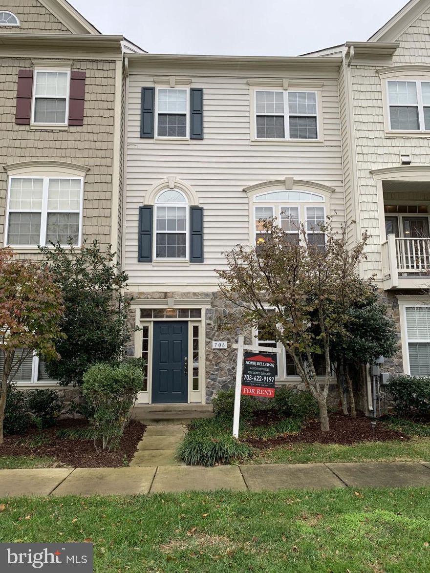 Rarely available Newer Two car garage town home at Belmont Bay sought after community***Great open floor plan with Hardwood floors on main level***Newer Carpeting**Double sided fireplace on Main level**Waterfront community with great walk ways and amenities***