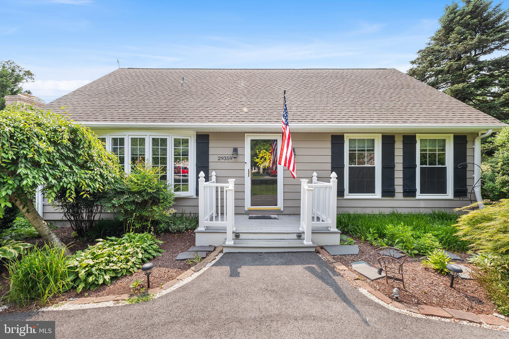 NEW PRICE AND NEW CARPET! SALT WATER ABOVE GROUND POOL IS READY TO OPEN AND ENJOY FOR THE SUMMER! Welcome to this beautifully maintained and updated 4-bedroom, 2 bath Cape Cod home, perfectly situated on a spacious, professionally landscaped corner lot in Easton. A resurfaced circular driveway with a deep parking pad provides ample space for 5+ vehicles, framed by vibrant perennial gardens. The inviting front porch, upgraded with durable vinyl railings and low-maintenance Trex decking, enhances both curb appeal and longevity. Step through the front door into a spacious living room that seamlessly flows into the formal dining area. Luxury vinyl flooring runs throughout the living, dining, and hallway spaces, offering a clean, cohesive look that’s as stylish as it is durable. The remodeled kitchen (2018) boasts generous counter space, ample cabinetry, and stainless steel appliances. A cozy den with a fireplace offers the perfect retreat for gatherings, while the adjacent four-season room—lined with wall-to-wall windows—provides breathtaking views of the private backyard oasis. The main level features two spacious bedrooms sharing a beautifully remodeled hall bath. Upstairs, the primary suite, an additional bedroom, and a remodeled bathroom are complemented by generous hallway storage—including a large closet that could easily be converted into the perfect laundry space for added convenience. Outdoors, your private sanctuary awaits, complete with lush plantings, elegant hardscaping, and a picturesque patio. The newer saltwater above-ground pool (2021) with a stylish deck and vinyl railings adds the perfect touch for summer relaxation. LOOK AT THESE UPGRADES! Replaced water main (2024), full interior repainting (2023), a downstairs bathroom remodel with updated plumbing (2023), new upstairs windows (2023), and exterior power washing (2023). The asphalt driveway was resurfaced in 2022, while the patio received a Pinnacle concrete coating in 2021. Exterior updates in 2020 included repainting with new board and batten shutters, as well as the addition of Trex decking and vinyl railings to the front porch. A crawl space encapsulation with humidifier was also completed in 2020. Other notable upgrades include a Mitsubishi mini-split AC system for the main level (2018), a new hot water heater (2017), the installation of luxury vinyl flooring in the living room, dining room, and hallway (2017) and 3 security storm doors. This home has all new light fixtures. There is also a garage sized shed with automatic garage door opener, drywall insulation, power and work bench. Located just moments from downtown historic Easton, enjoy convenient access to shopping, dining, entertainment, arts, and year-round events. Move-in ready and waiting for you to call it home!