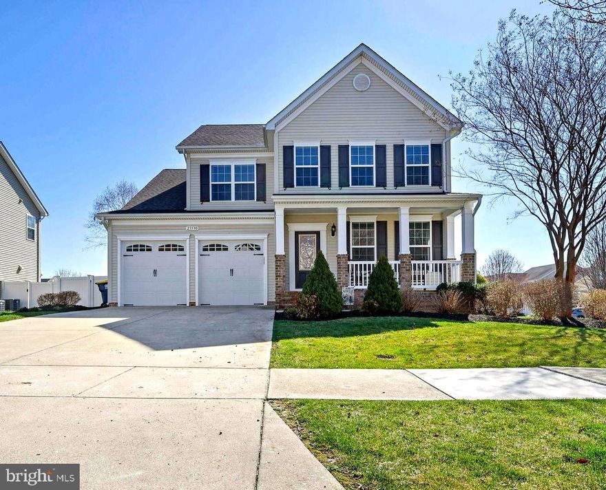 Welcome home to the Patuxent QBH floor plan in sought-after Leonard's Grant Neighborhood, the epitome of community-centered living in Leonardtown, Maryland. Situated on a corner lot with extensive landscaping and a private fenced backyard, this home offers stunning curb appeal and a relaxed indoor-outdoor living with a large 18' x 18' composite screened deck and a concrete patio for gatherings.

Inside, warm wood and carpeted floors complement abundant natural light, recessed lighting, and classic touches like a cozy fireplace. The kitchen is designed for everyday life and entertaining with a center island and double ovens, while a formal dining room adds quiet refinement. The owner’s suite is generous, featuring a soaking tub and a walk-in shower; upstairs laundry increases convenience.

The finished basement is equipped for fun and leisure with a built-in rock wall activity center and a projector setup create effortless movie nights and an active play space. Practical comforts include a two-car attached garage and ample storage. Residents enjoy a community center, common green, pool, and walking access to schools, the library, and local pubs and restaurants. A balanced, refined home in a great location. Come and see it while it lasts!