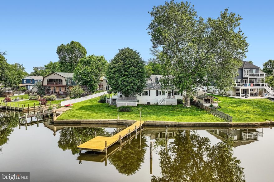Breathtaking Waterfront Retreat on Jones Creek! Welcome to your private oasis in the heart of Sparrows Point, a rare opportunity to own a spectacularly renovated single-family home offering approximately 140 feet of panoramic waterfrontage on .33 acres of pristine shoreline. This stunning property features two piers, a private boat ramp, and breathtaking views from nearly every room, creating the ultimate waterfront lifestyle experience. Step inside to a light-filled foyer with immediate water views, a convenient half bath, and laundry room. The open-concept main level invites you into a gourmet chef’s kitchen complete with granite countertops, under-cabinet lighting, stainless steel appliances, cooktop, built-in oven and microwave, crisp white cabinetry and stunning backsplash. The large kitchen bar offers plenty of seating, and the adjacent dining area flows effortlessly into a spacious living room with a cozy sitting nook, all designed to showcase stunning water views. From this space, step out onto the first of two expansive decks, where you can soak in the waterfront breeze and take in truly unforgettable views. The upper level features two generously sized bedrooms and a beautifully updated custom tiled full bath. What makes this property truly unique is its flexible layout, ideal for large families or multigenerational living. Off the main living area, a separate wing includes a massive family/rec room/dining area with vaulted ceilings and sliding glass doors that lead to a second waterfront deck, perfect for entertaining. Here, you'll also find a luxurious full bath with a jetted tub and custom-tiled walk-in shower, and an exceptionally renovated second kitchen, never used, all brand new, featuring vaulted ceilings, granite countertops, white cabinetry, stainless steel appliances, custom backsplash, a spacious bedroom with walk-in closet, all with water views and a private upper-level bedroom complete the space with brand new egress skylight window, flooding the space with natural light! This wing offers its own separate entrance with a ramp, making it ideal for an in-law suite, guest quarters, or private family living. Throughout the home, you’ll find all-new luxury vinyl plank flooring, blending durability with high-end design. Additional highlights include an attached garage, a spacious driveway, a covered carport, and a partially fenced yard. The recently waterproofed basement offers an oversized storage area for all your needs. This home boasts two dual HVAC systems for efficient climate control, a 6-year-young roof,  a new main pier with fresh decking, new pylons and electrical hookups. A second pier, just five years new, complements the property, both ready to accommodate your boat, jet skis, or simply enjoy peaceful waterfront living. And when you’re ready to explore, hop on the paddle boat for a magical ride along the creek, just minutes from the brand-new Sparrows Point Park. Enjoy a full day of activities, from playgrounds and scenic walking paths to storytime and music & movement for your little ones, as well as activity rooms, a community center, athletic fields, and so much more, all just minutes from your dock. Whether you're entertaining on the dual decks, launching a boat from your own ramp, or simply unwinding by the water, this exceptional home delivers a lifestyle few can match. A true waterfront gem-inside and out. From boating adventures to sunset dinners on the dual decks, or simply unwinding with the gentle sounds of the water, this exceptional property invites you to live the waterfront lifestyle to the fullest. Truly a rare find, where comfort, beauty, and location meet. So, what are you waiting for? Come take a tour, fall in love, and make this enchanting waterfront retreat the next chapter in your story!!!