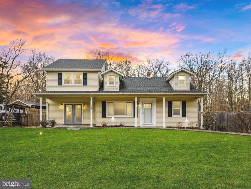 Experience the epitome of Havre De Grace living in this meticulously updated single-family home, nestled on a coveted .51-acre flat lot. The property exudes charm, with its expansive covered porch welcoming you into a haven of tasteful finishes. Step inside to discover a front sitting room and an oversized family room featuring a wood-burning stove, creating a cozy ambiance. The kitchen has been thoughtfully modernized with white cabinetry, granite countertops, and stainless steel appliances enhanced by additional removable built-ins, perfect for accommodating both your family and four-legged friends. The kitchen seamlessly opens to the formal dining space, providing access to the covered back deck—ideal for outdoor gatherings. Down the hall, you'll find two bedrooms and a full bathroom. Venture upstairs to discover three more bedrooms and an additional full bathroom. The primary bedroom offers ample space, presenting an opportunity for the addition of another bathroom and/or closet. Outside, the backyard transforms into a true oasis, enclosed by a large wooden privacy fence. Enjoy the charm of a cozy fire pit area, an additional entertaining space, and two sheds with electricity— one equipped with both heat and a concrete slab. Parking is effortless with the extended driveway accommodating up to eight cars. For practicality, the crawl space serves as a temperature-controlled storage solution. Recent upgrades include roof (2016), HVAC (2016), wood stove (2017), bedroom and living room fans (2019), wood privacy fence (2019), windows and front door (2020), yard fire pit area (2021), sump pump (2021), tankless water heater (2023), deck storm door and awning (2023), carpet and paint (2023), and more. Welcome home!