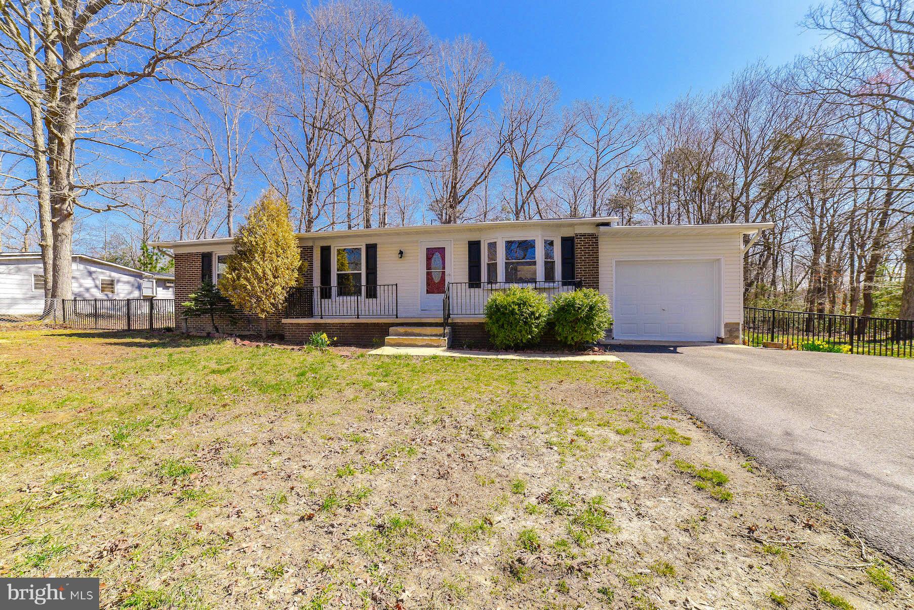 This home is beautiful. The established trees in the front and wooded backyard give this house a great feel. New countertops and carpet paint and tile in the bathroom really makes this home show well. New roof in end of 2018! Fenced in backyard!