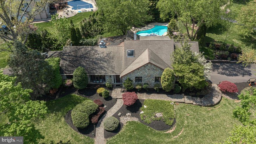 Fabulous 4 bedroom stone-front single nestled on a quiet street in popular Green Valley of Churchville !  Your stunning private oasis boasts meticulously landscaped corner lot with a stunning, in-ground heated pool,  cozy firepit, huge deck... perfect for entertaining!  Award-winning Council Rock School District! Step thru the new front door with custom sidelights and into the bright hardwood foyer!  The sundrenched living room features a propane fireplace,  bay window, plush carpeting, and opens to the elegant dining room,  complete with gleaming hardwood flooring, recessed lighting, modern light fixture, and  built-ins.  The gourmet kitchen boasts beautiful white cabinets, tile backsplash, recessed lighting, Pergo floors, stainless steel fridge, and breakfast room! There is a study/office with plenty of built-in shelving and a huge solarium/conservatory with bar that feels like your very own mountain retreat!   Rare first floor master suite with huge sitting area and en-suite bathroom! The additional bedrooms are spacious, with large closets, designer paint, plush carpeting, ceiling fans, and recessed lighting. The 4th bedroom is open loft bedroom with spiral staircase.  Can be used as a media/game room !  Don't forget the oversized, 2-car garage with extra storage, as well as the  two driveways on either side of the home, for ample 10+ car parking! Conveniently located minutes from Route , Buck Rd, 276, 232, 213,  Springfield Lake, Churchville Nature Center, and easy access to NJ  !