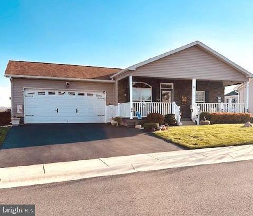 Great opportunity to own this well loved and cared for home located in convenient Douglas Village. These original owners put thousands of dollars in upgrades and improvement, too numerous to list. Enter the home from the covered front porch which is highlighted with ceiling fans and LED lights that you can change the color for the season, or your mood. Enter into the formal dining room , or possible formal living room that features  9  foot ceilings and recessed lighting. There is an arched entry with half columns that separate this room from the open Kitchen, dining area and family room.  The family room has a gas fireplace. The kitchen has many upgrades such as the cabinets, recessed lights and Corian countertops with matching island. Off the kitchen is a nice sized laundry room .  A sliding glass door in the dining area leads to a vinyl deck and railings and step down patio with block pizza oven / fireplace.  The main bedroom has a tray ceiling with a ceiling fan , There's a walk in closet and full bath with whirlpool tub and linen closet. The other 2 bedrooms also have nice closet space and ceiling fans. there is a hall bath for guests that has a walk in shower. The home features low maintenance exterior and tilt single hung windows plus the owners are offering a One Year Home Warranty with the purchase. This community does not have a homeowners association but does have rules and regulations and the ground rent includes mowing, weed wacking, snow plowing of the roads and public walkways, weekly trash removal, access to the club house, pool, library and gym. The sewer and water gets billed through Douglas Village