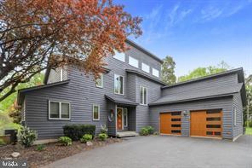 COMMUTERS DREAM!  Want to feel away from it all yet only minutes to the VRE??   Lofty and bright architectural gem with treetop views and a seasonal glimpse of the Potomac River. Located near the VRE commuter rail, yet away from it all on more than two and a half acres of very private natural beauty. Four bedrooms total, 3.5 baths, including two bedrooms and a full bath on the main level, one of those bedrooms has private entry to the bath. There is an additional powder room on the main level for guests. The upper level features the primary bedroom with sky-lit en-suite bath, walk-in closet and unique loft space. This level features an additional bedroom with private, en-suite bath. On the main level, check out the dazzling, updated kitchen overlooking the two-story living room with windows everywhere. Two car garage and plenty of surface parking. Less than five miles from the Brooke VRE Commuter Rail Station.  Enjoy the beach and river access at Aquia Landing Park